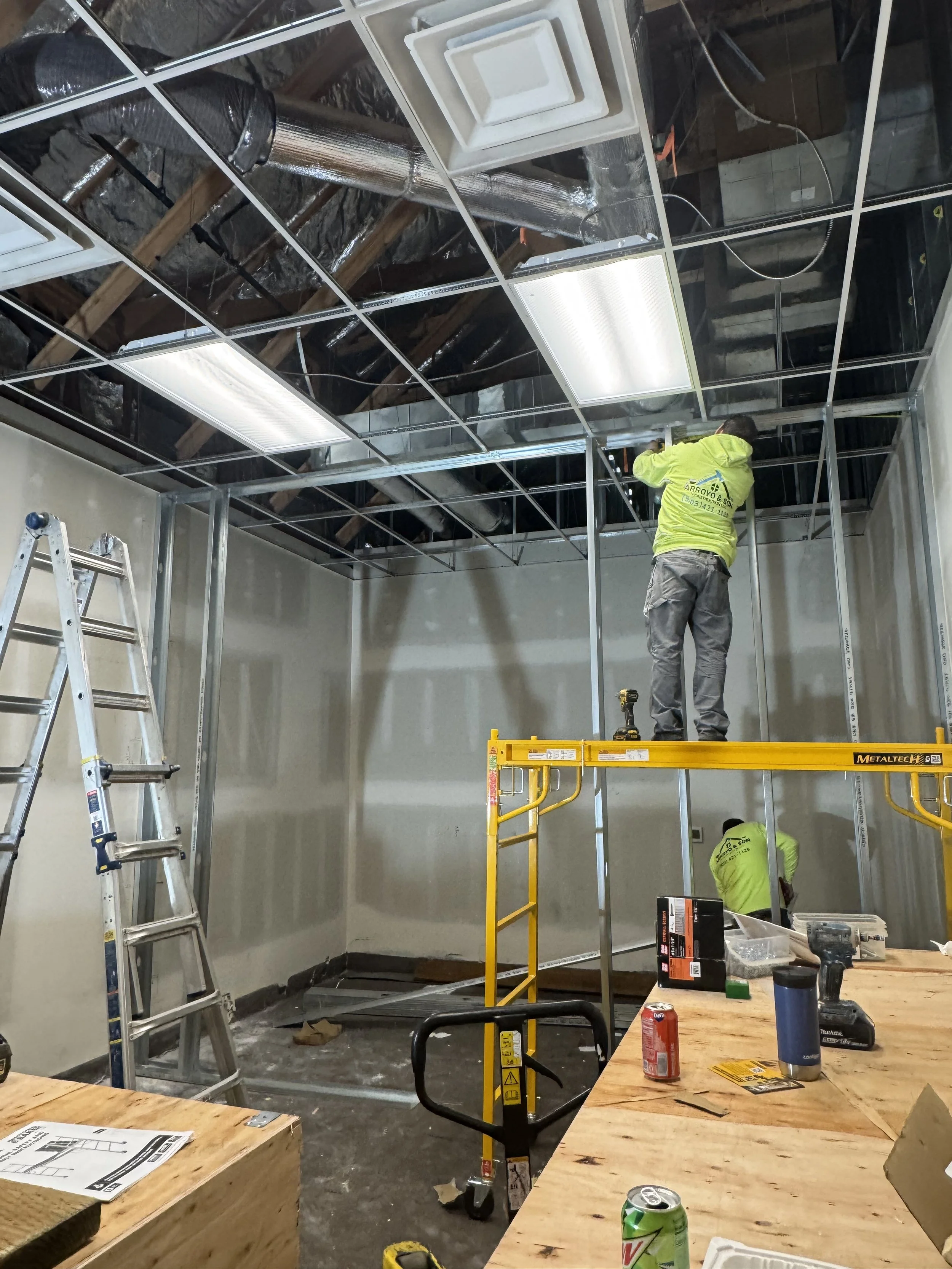 arroyo crew on site installing overhead lighting