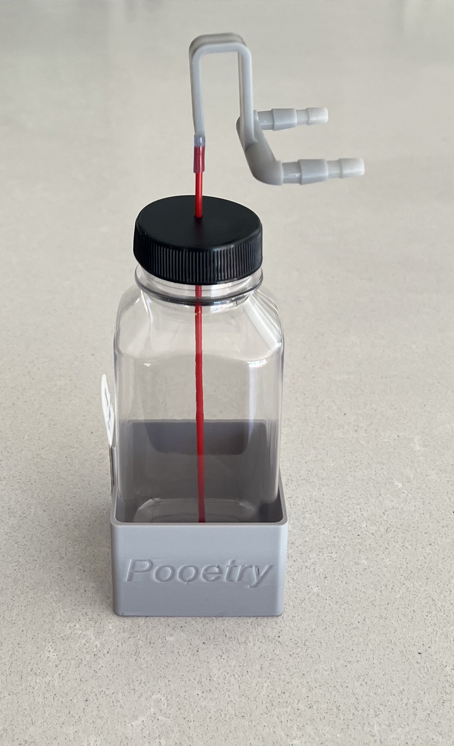 A Pooetry toilet cleaning and freshening kit, ready for installation.