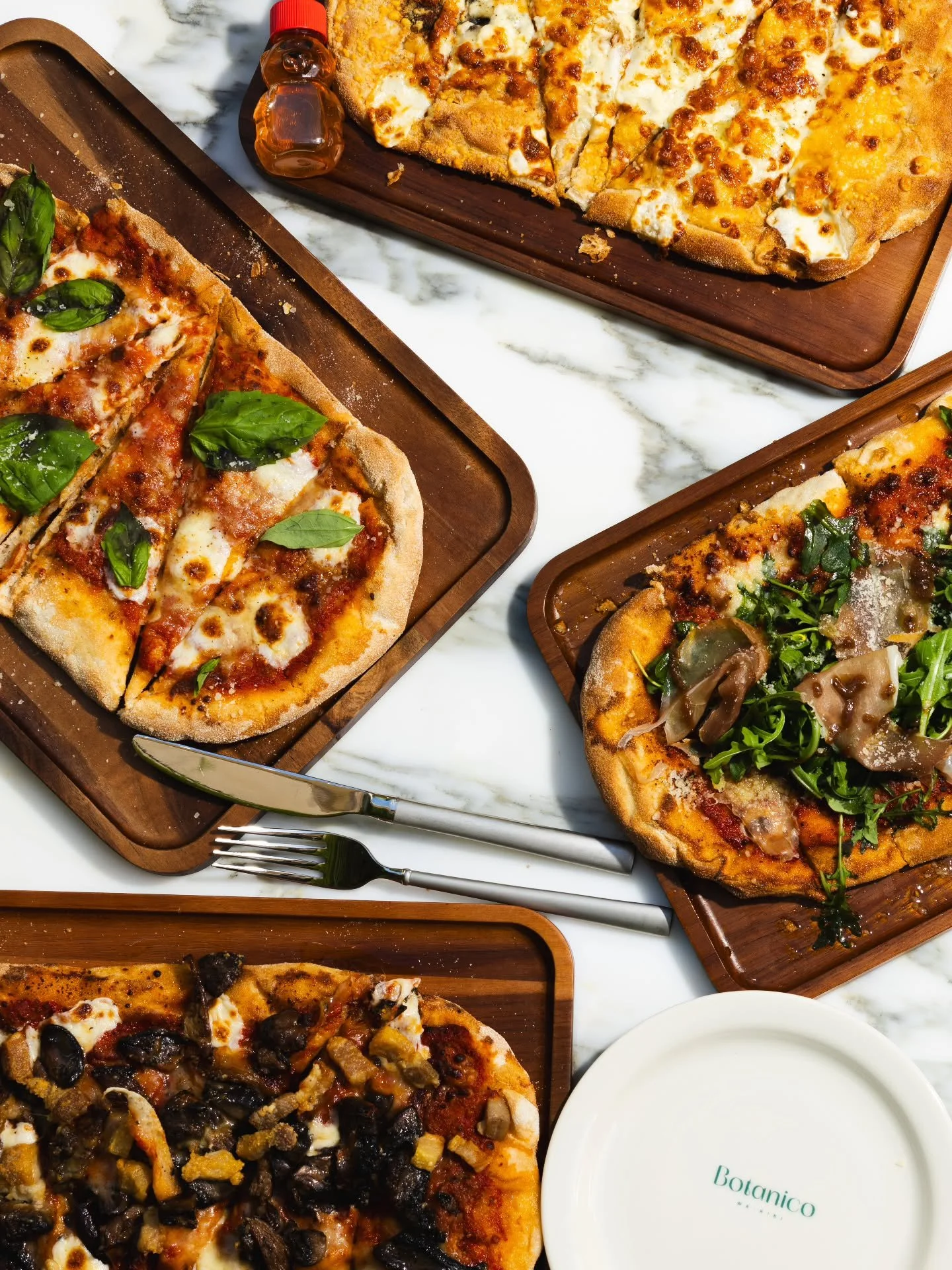 Roman-style pinsa, crafted for a refined lunch.

Light, crisp, and airy, with a golden crunch and soft center that lets every ingredient shine.  From classic Margherita to prosciutto and arugula, rich four-cheese with local honey, and mushroom pancet