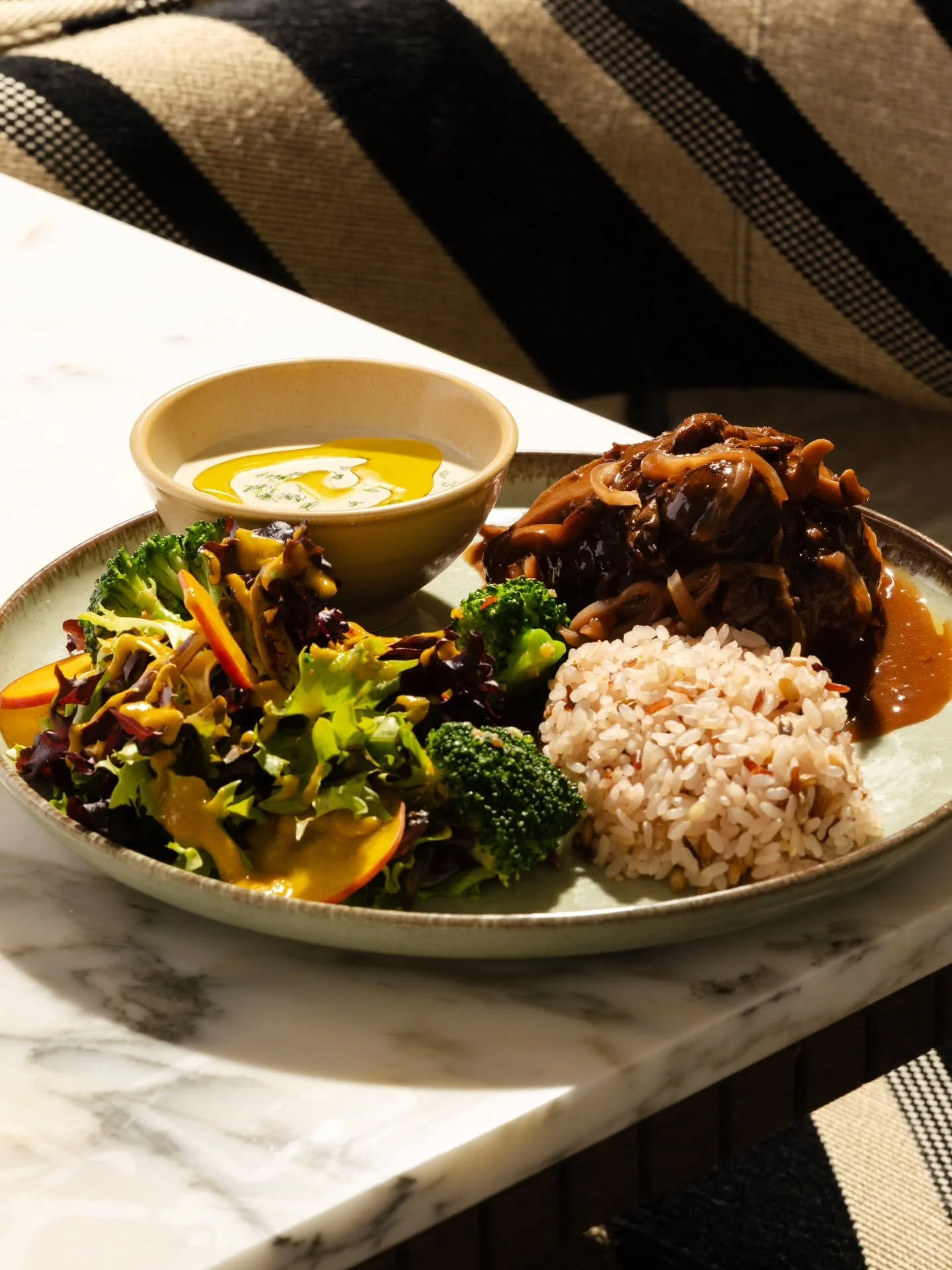 Botanico introduces a limited time lunch experience.

The Botanico Style Polpette Plate features house made seasoned ground beef, crisp mixed salad with apple dressing, mini soup, and grain rice, finished with your choice of mushroom demi glace or to