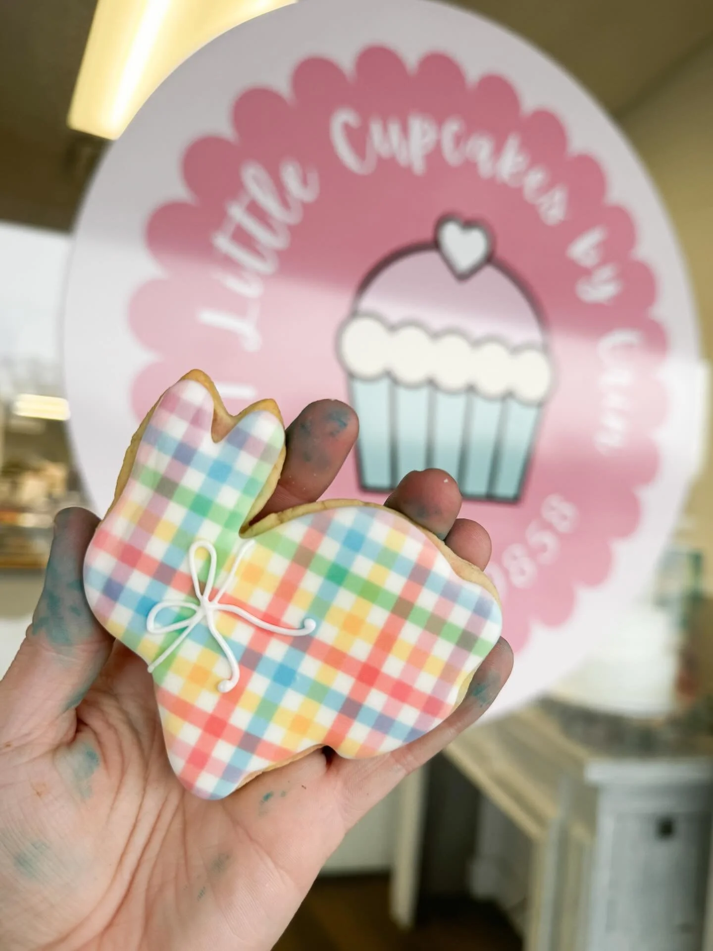 The cutestttt bunnies are hopping into the bakery this week! 🐇

(Also, well aware hands are blue. It&rsquo;s a daily occurrence in a baker&rsquo;s life 🫢)

#7littlecupcakes #easter #eastercookies #bunnycookies #toledoohio