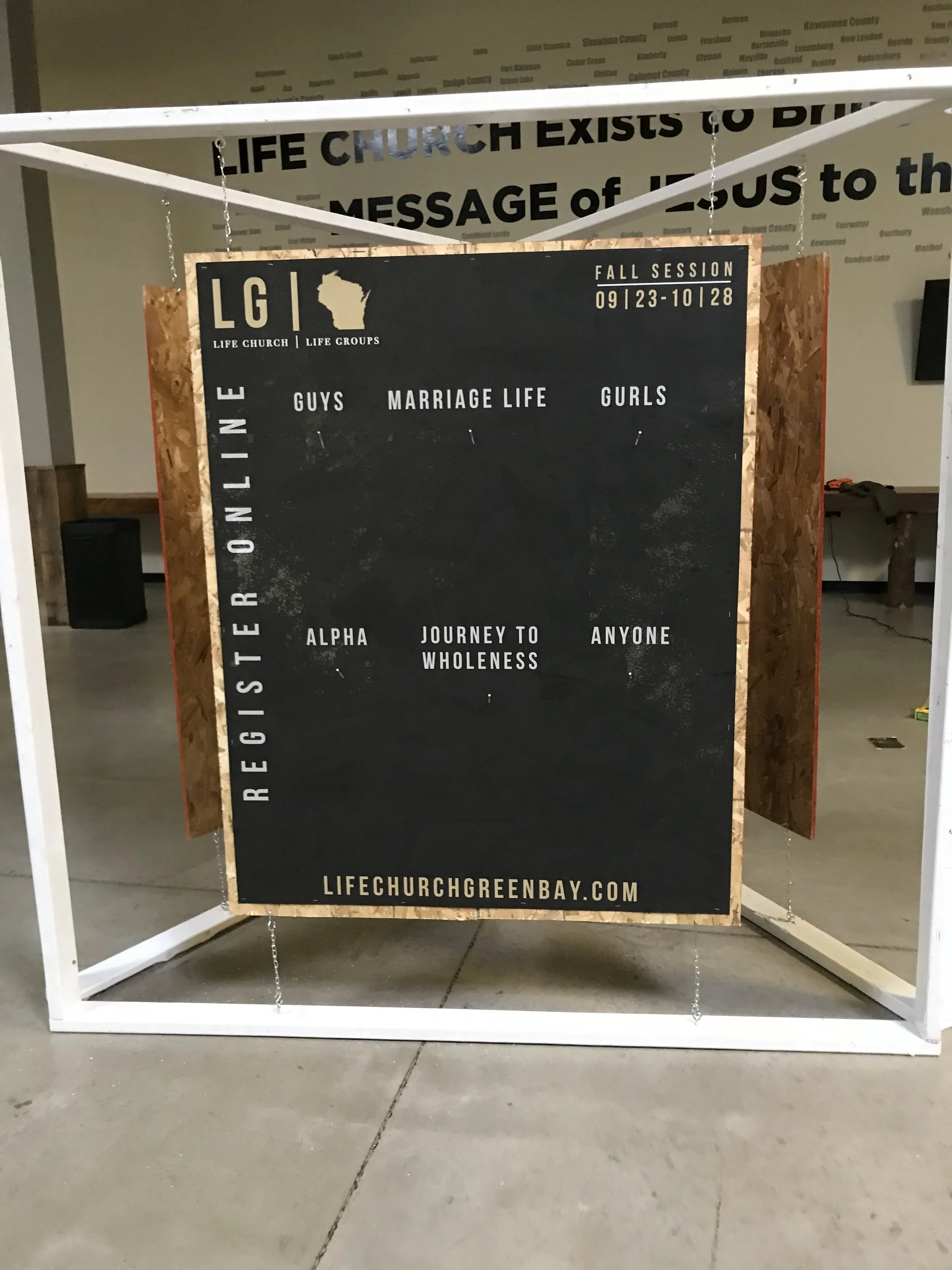 Sign for Life Church Green Bay with fall session dates, focus on guys, marriage life, and girls, featuring Wisconsin map and church website at bottom.