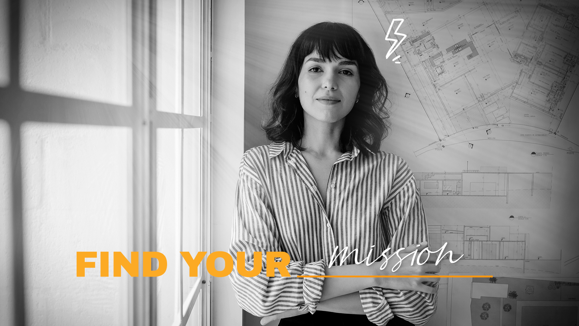 A woman with dark hair and a striped shirt standing near a window with architectural plans on the wall behind her. The image has the text 'Find Your Mission' overlaid, with a lightning bolt icon near her head. 