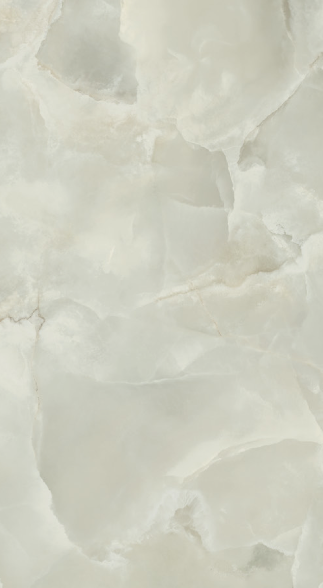 Nahaufnahme einer weißen und cremefarbenen Marmoroberfläche mit natürlichen Mustern.