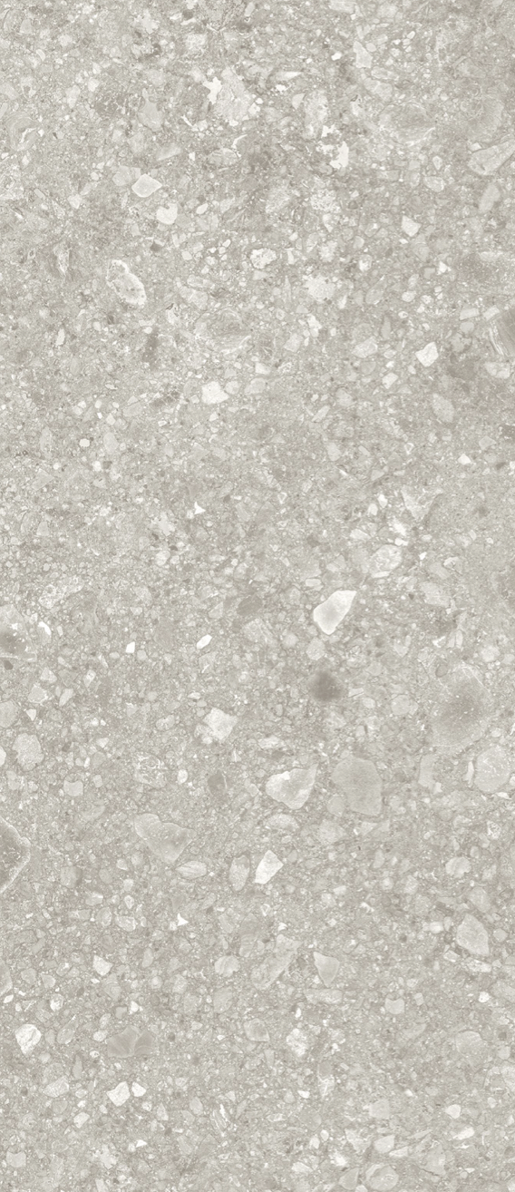 Nahaufnahme einer Estrichbodenoberfläche mit kleinen Steinen und Quarzen.