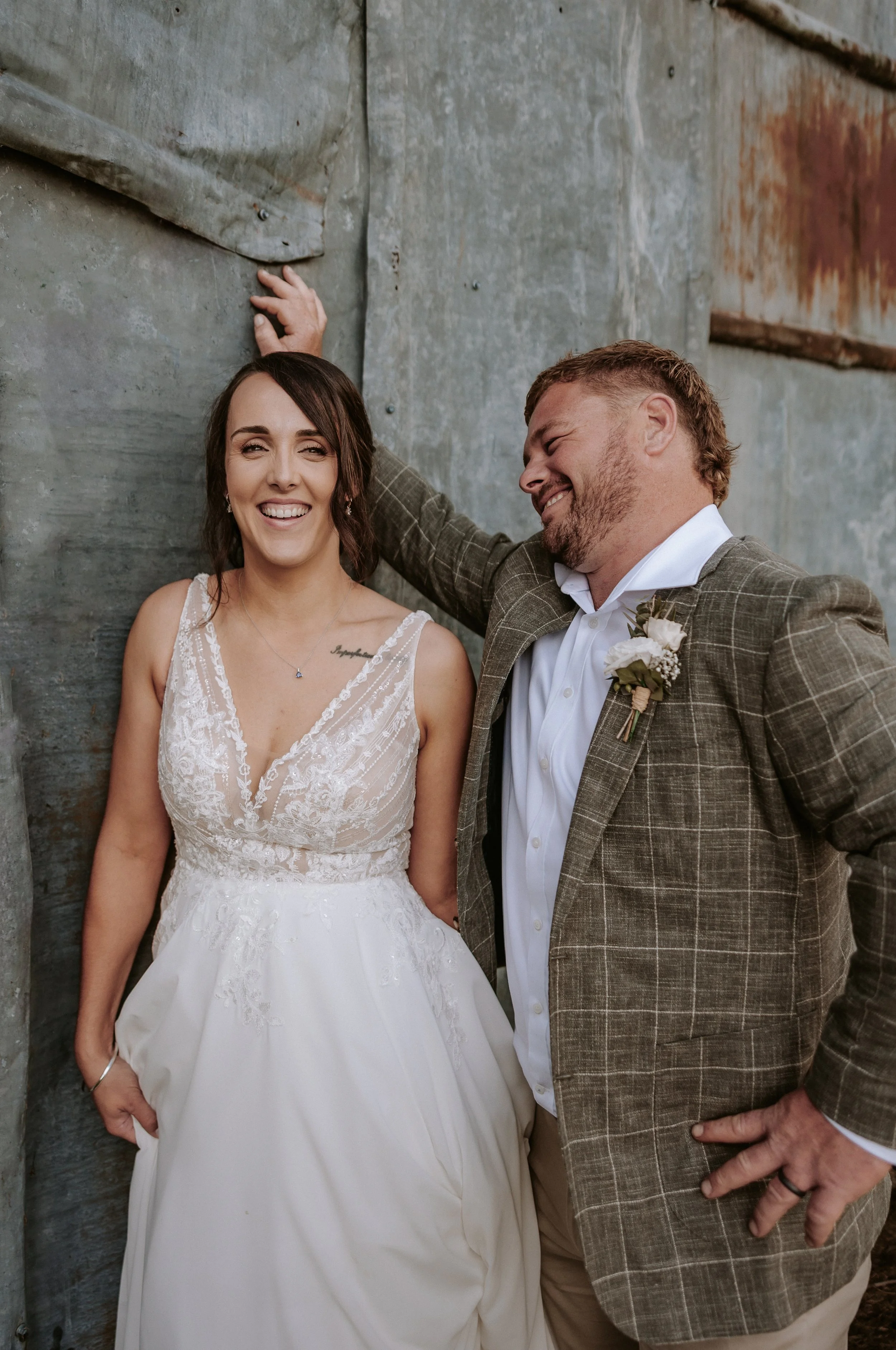 bride and groom laughing