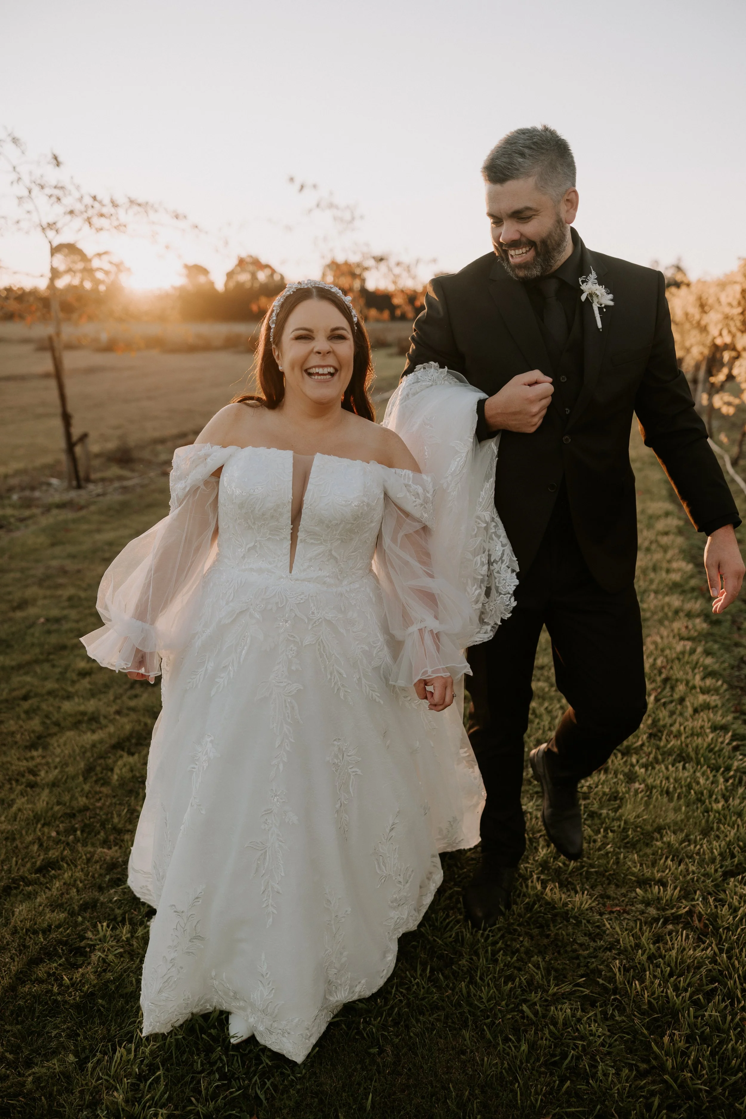 couple smiling and walking towards camera