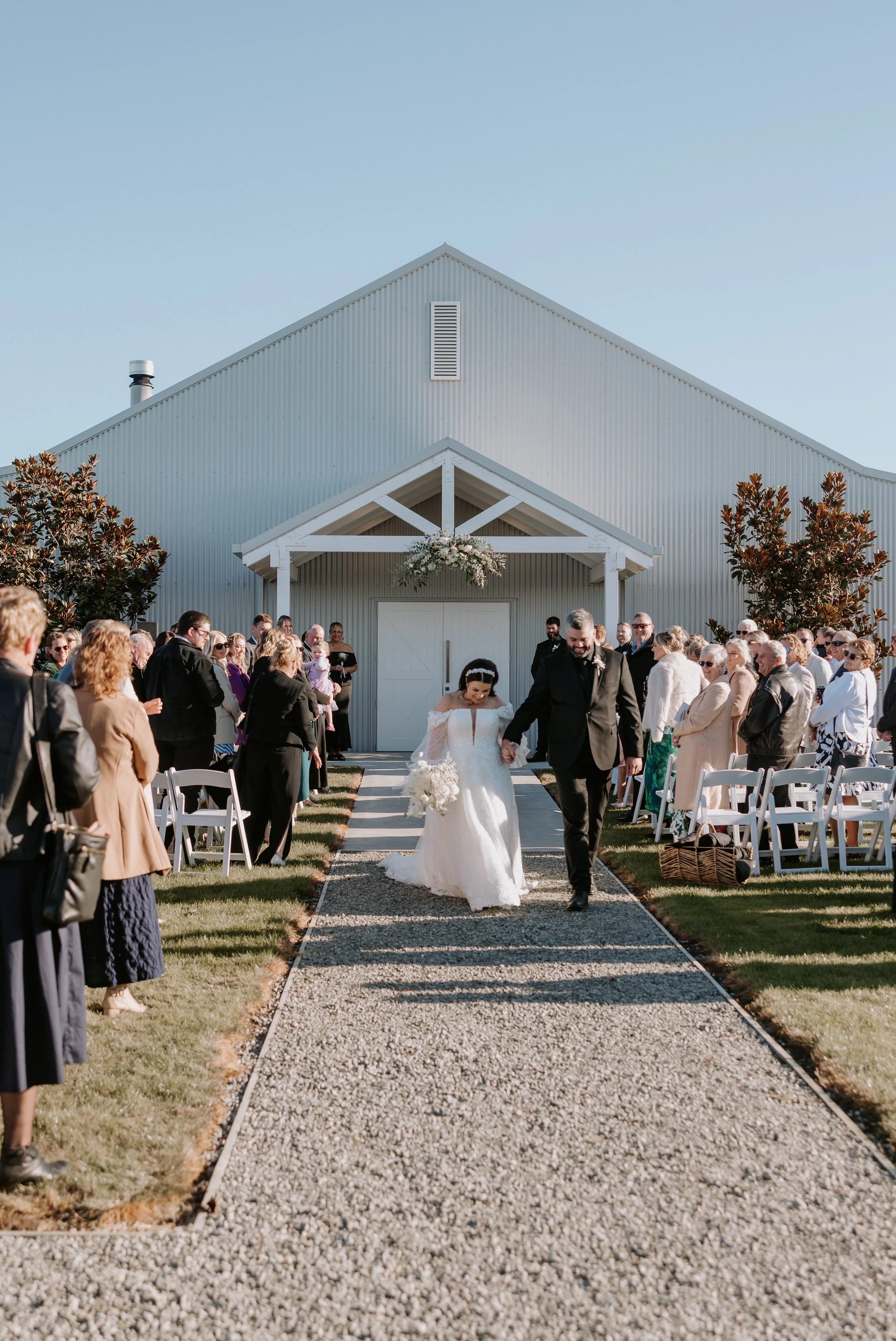 bride and groom walking down aisle