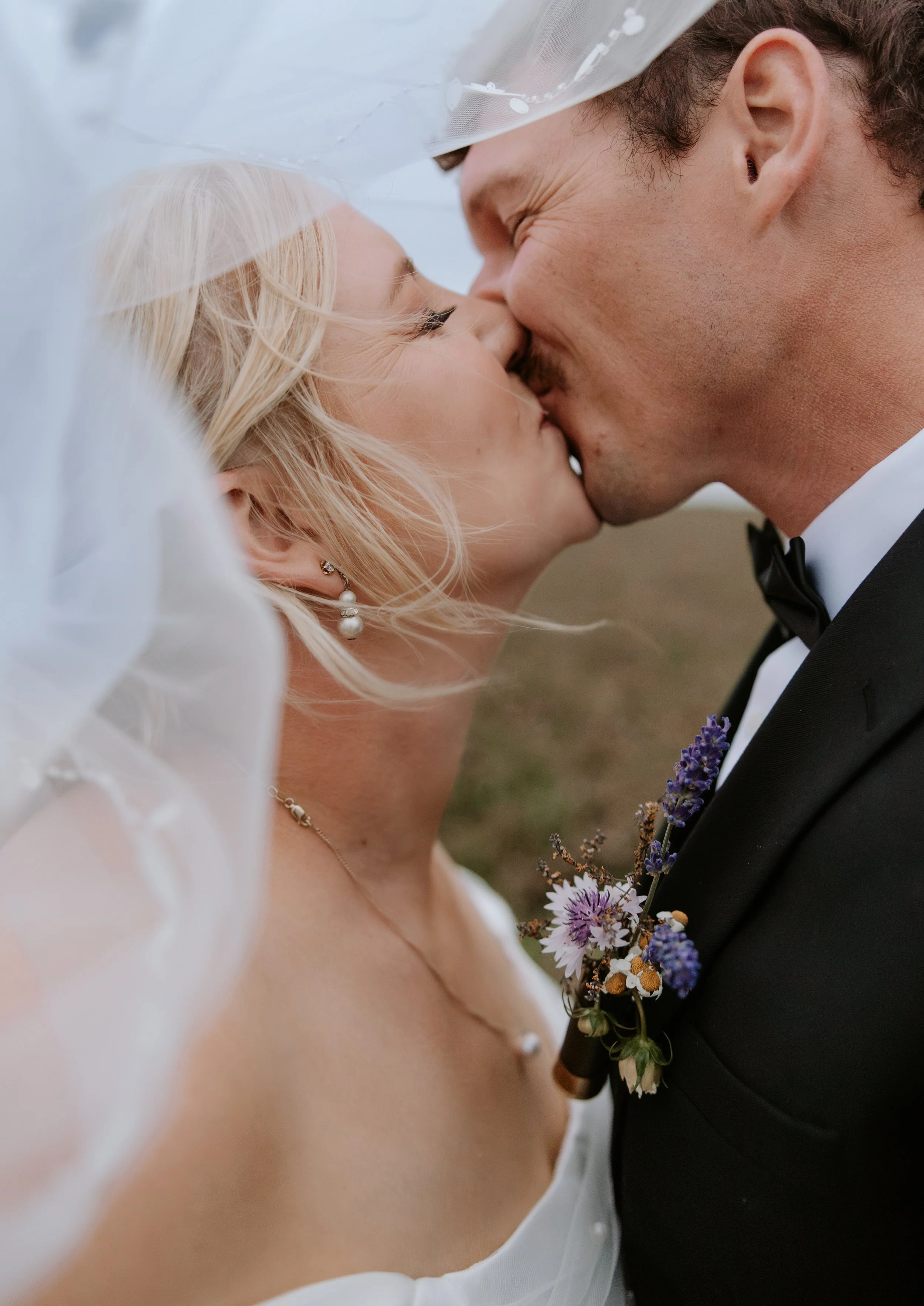 bride and groom kissing