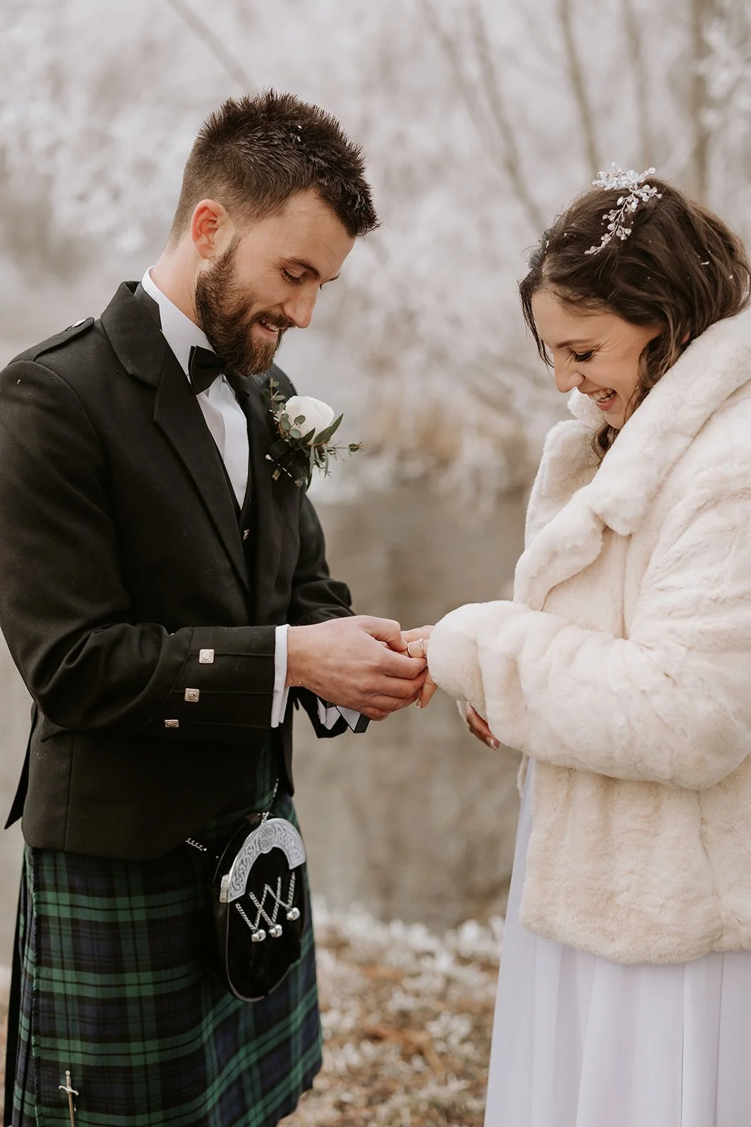 bride and groom exchanging rings