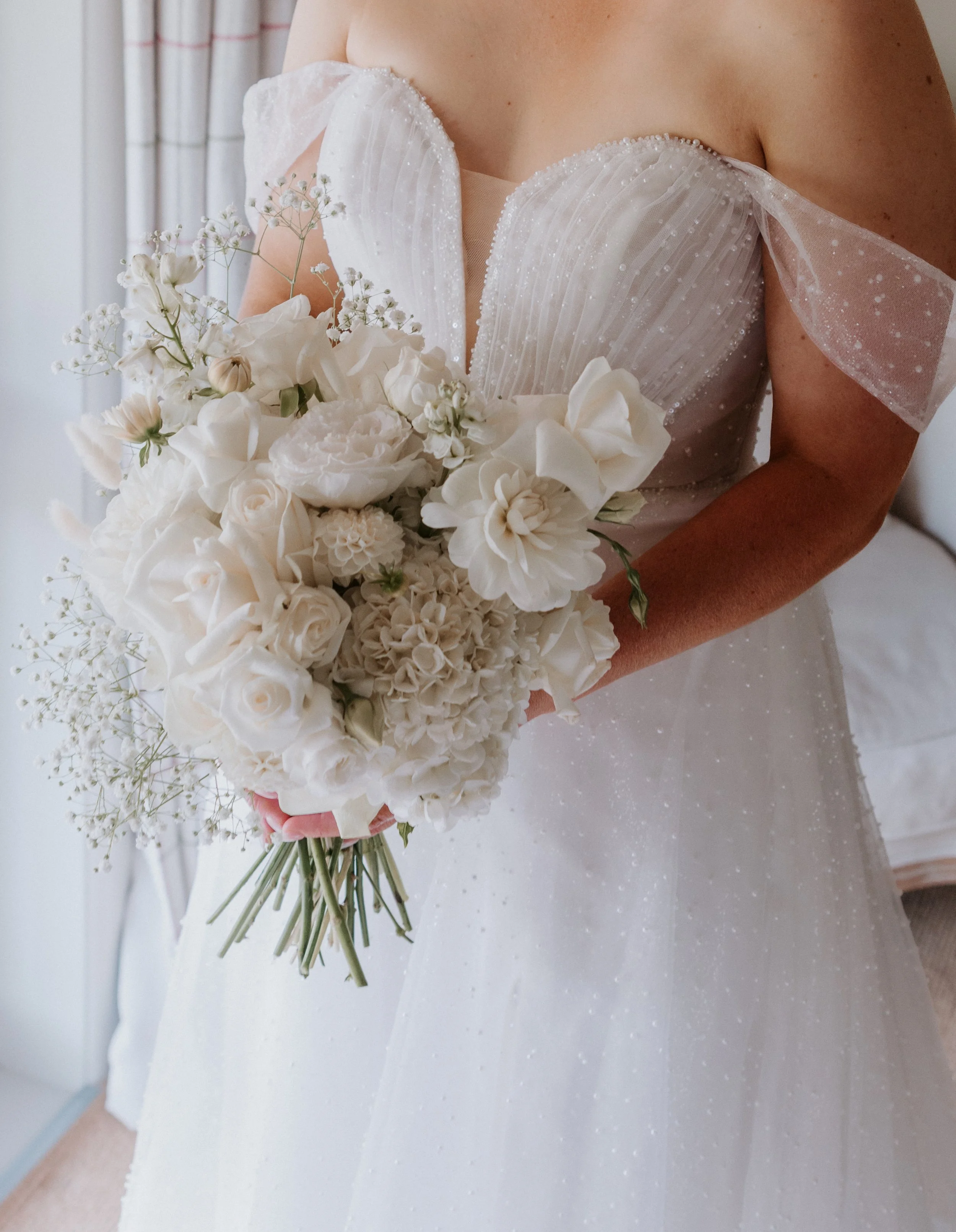 wedding dress and white florals