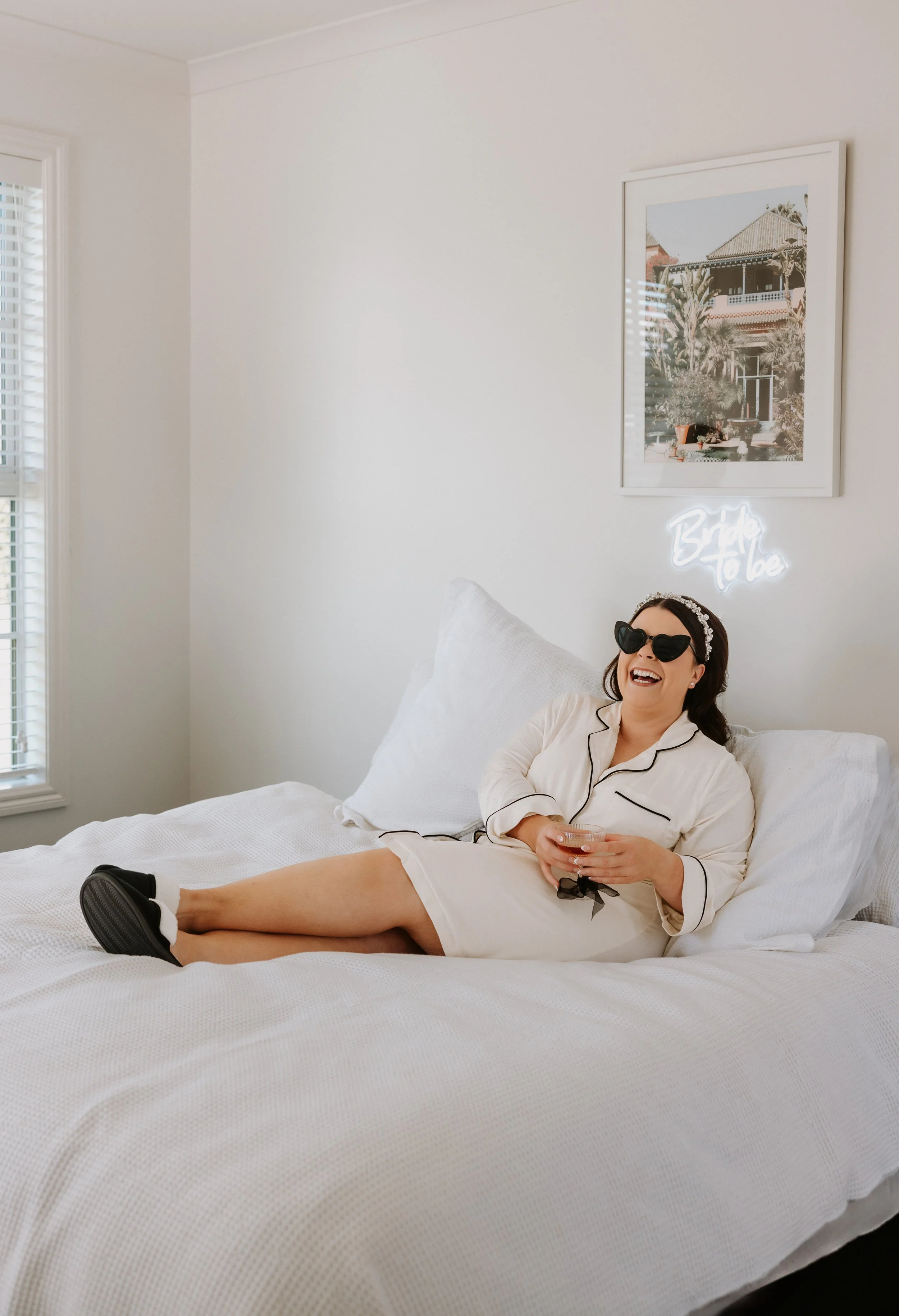 bride getting ready with heart glasses