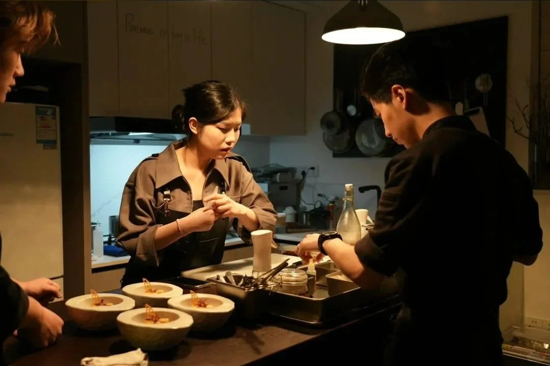 Kitchen team at a Black Pearl restaurant preparing dishes for service