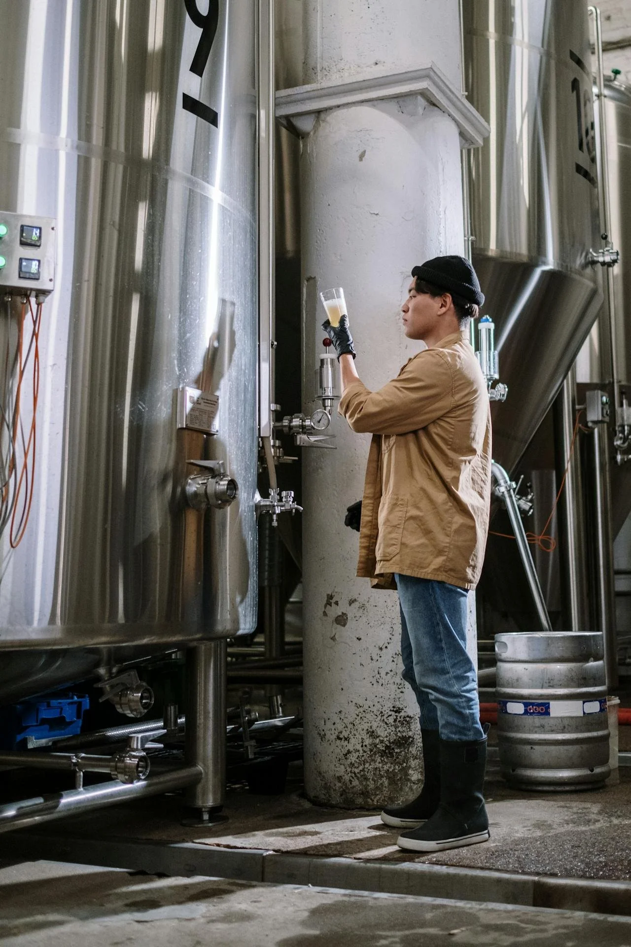Brewer checking the quality of craft beer at a brewery in Takamatsu