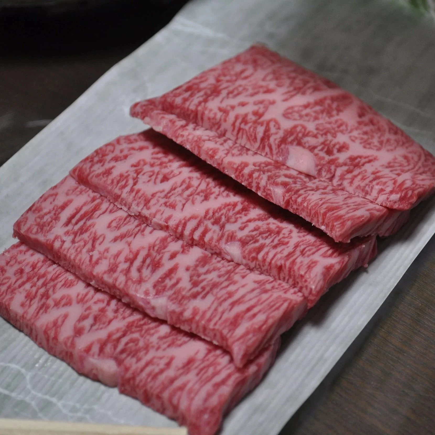 Sliced olive beef from Shodoshima, Kagawa Prefecture, on a plate ready to be grilled