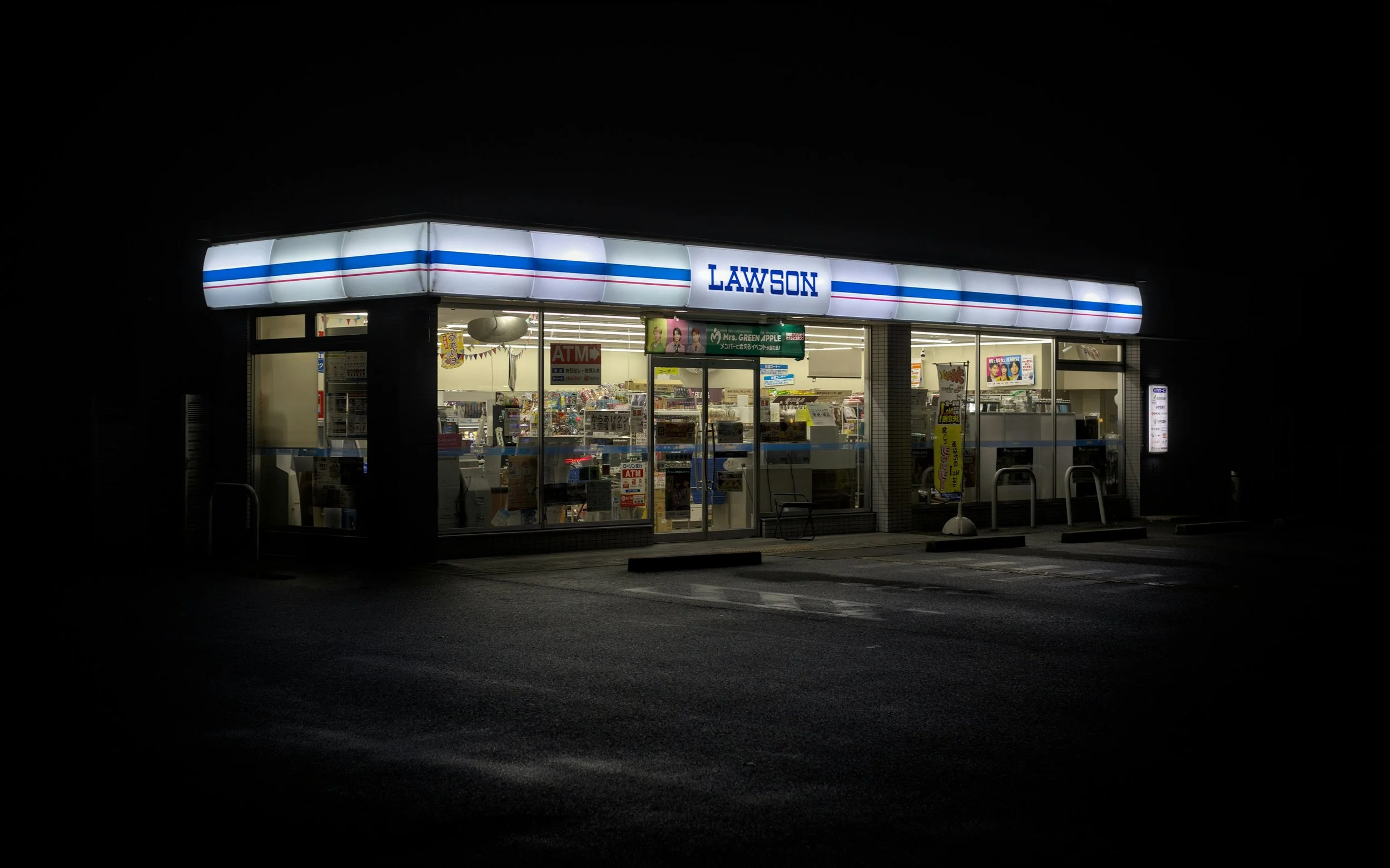 Exterior of a Lawsons convenience store at night