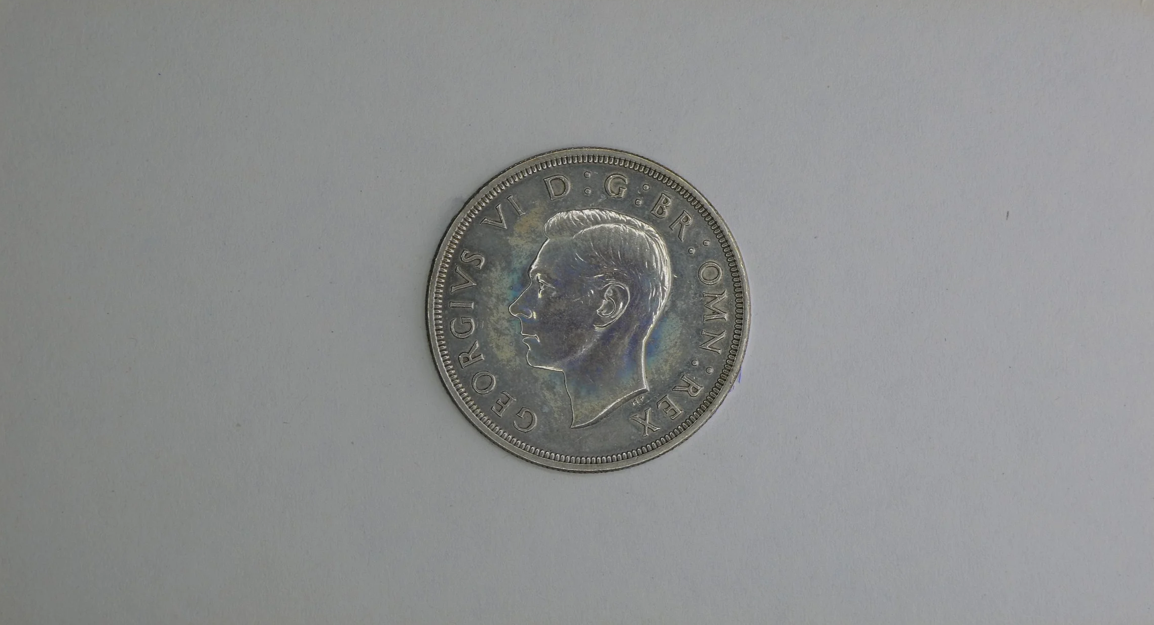 Card containing 1937 King George VI Coronation Commemorative Crown rear