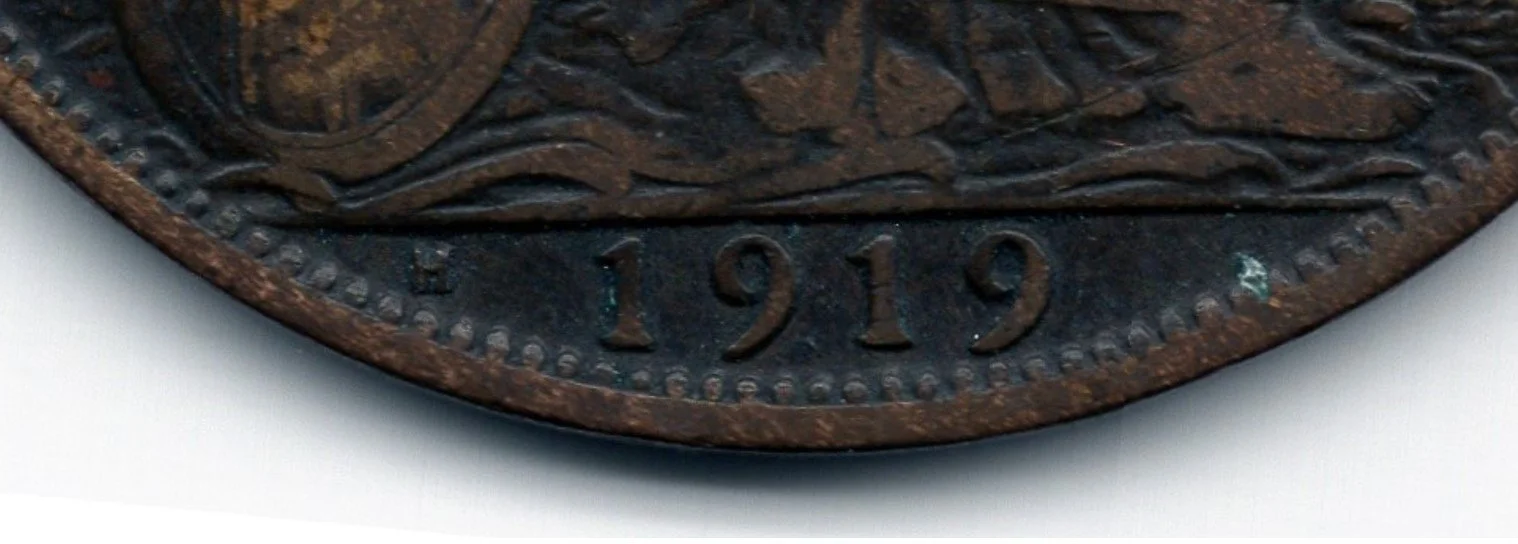 Close up of 1918 Penny with Heaton mint marks 