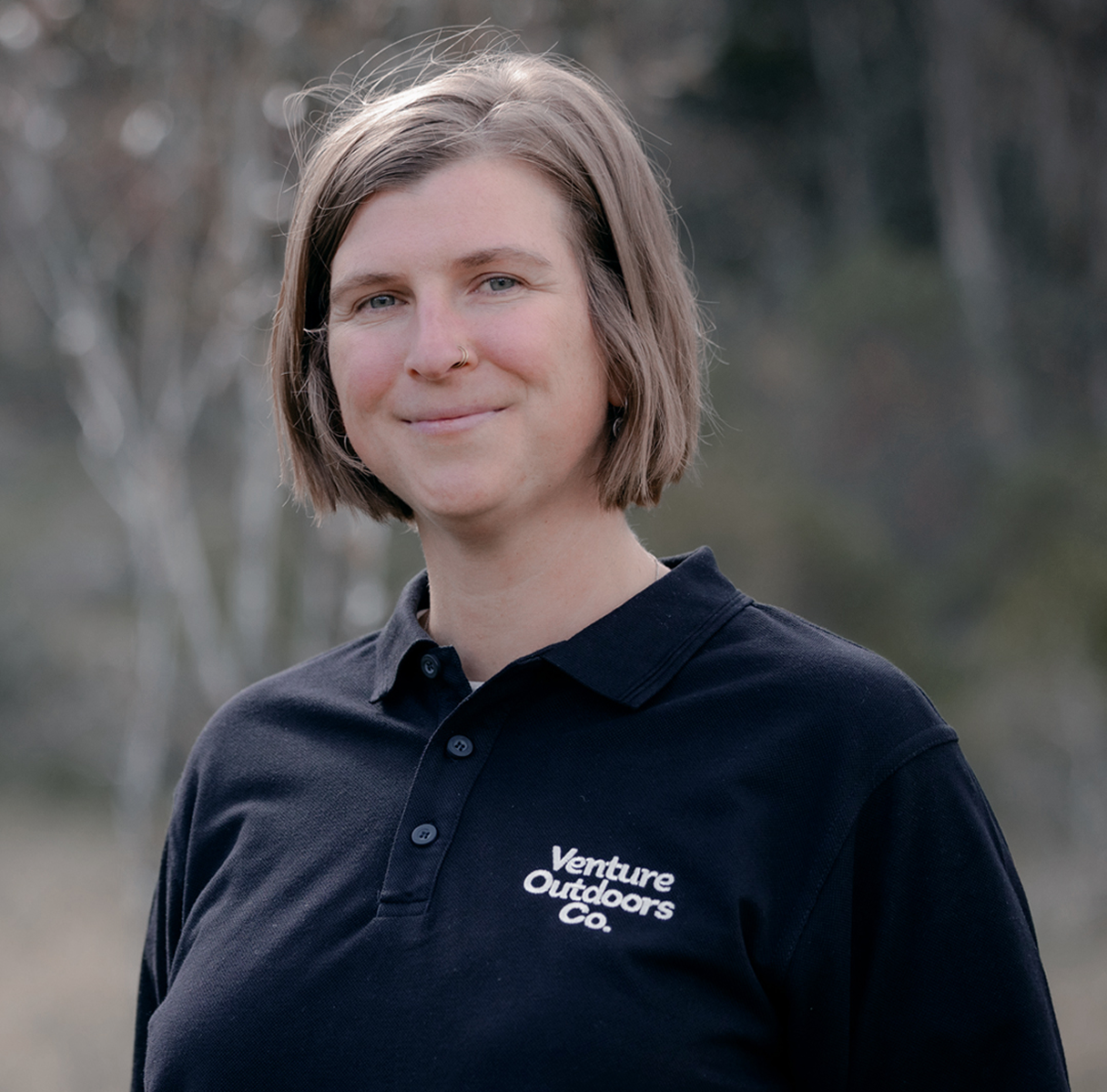 Portrait of Rachel Petrou, Venture Outdoors Co. team member wearing uniform outdoors.