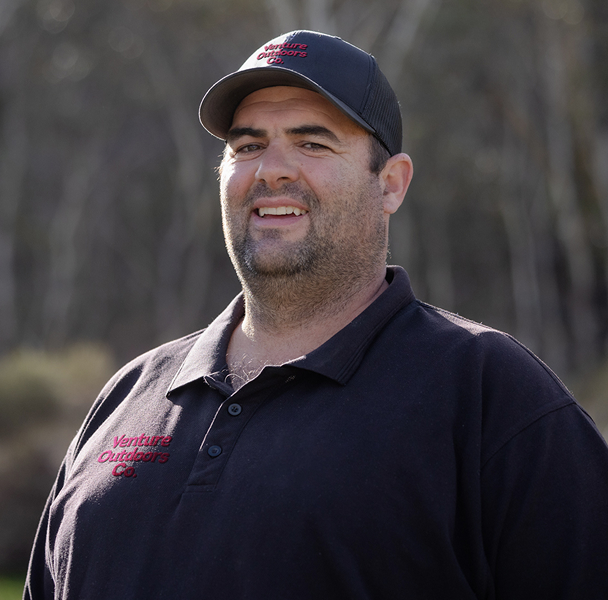 Portrait of Stefan Klem, Venture Outdoors Co. team member wearing uniform outdoors.
