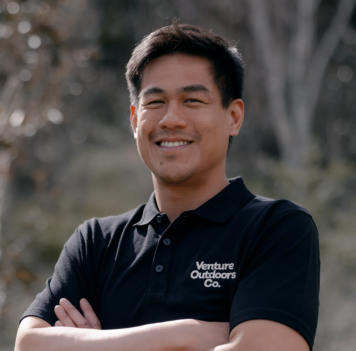 Portrait of Josh Shukor, Venture Outdoors Co. team member wearing uniform outdoors.