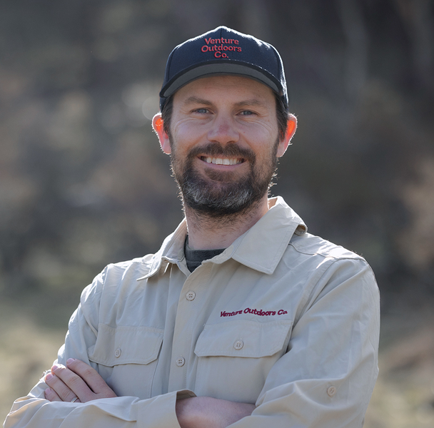 Portrait of Jacob Lockley, Venture Outdoors Co. team member wearing uniform outdoors.