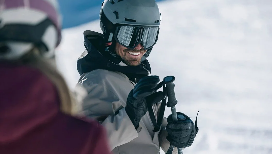 Snowboarder wearing helmet and goggles with Venture Outdoors Co. winter gear and equipment.