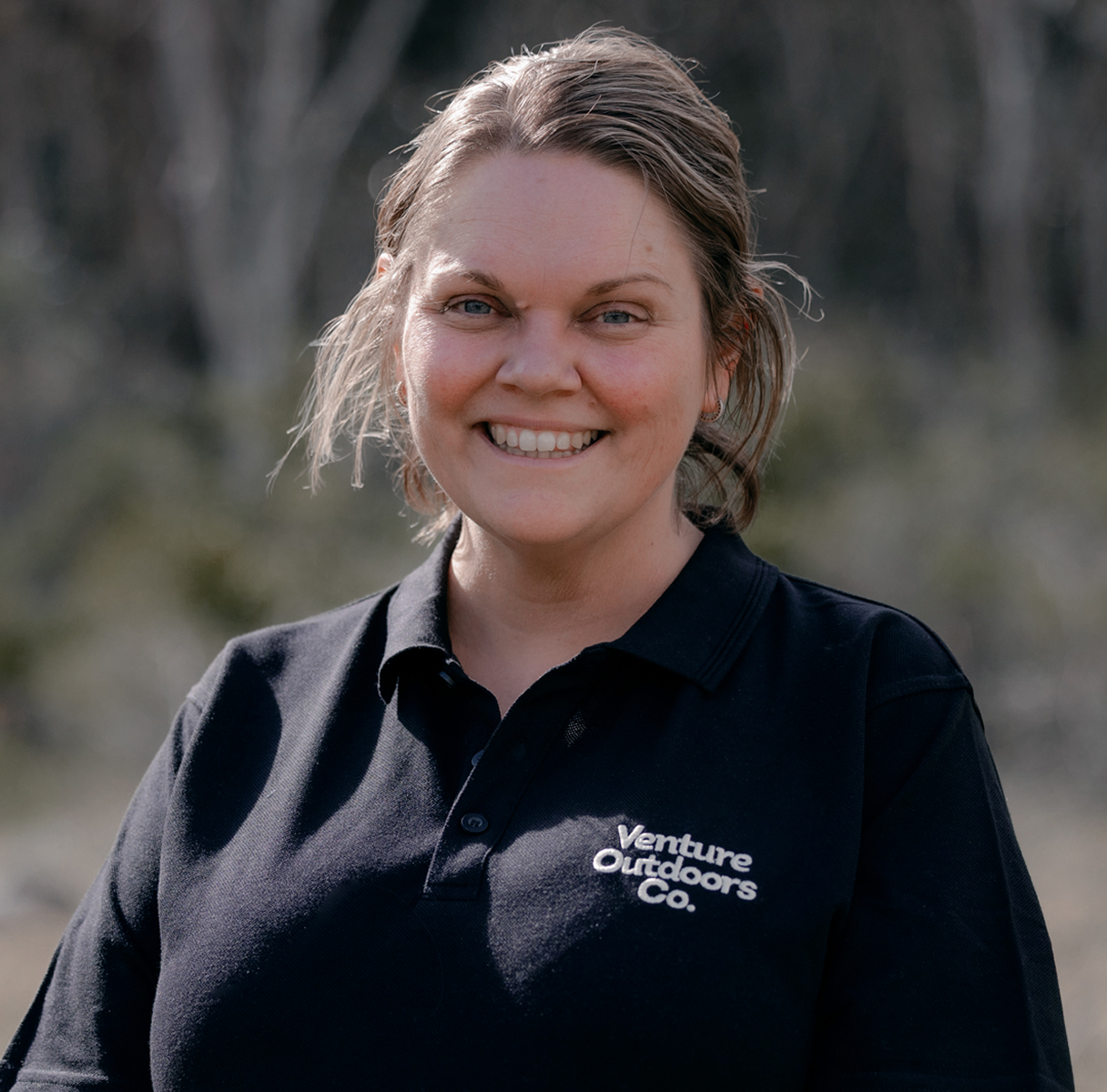 Portrait of Danielle Marks, Venture Outdoors Co. team member wearing uniform outdoors.