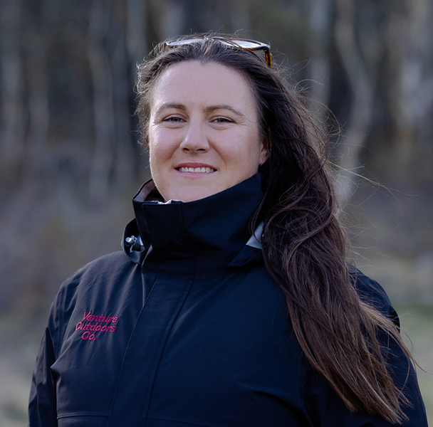 Portrait of Kirra Attiken, Venture Outdoors Co. team member wearing uniform outdoors.