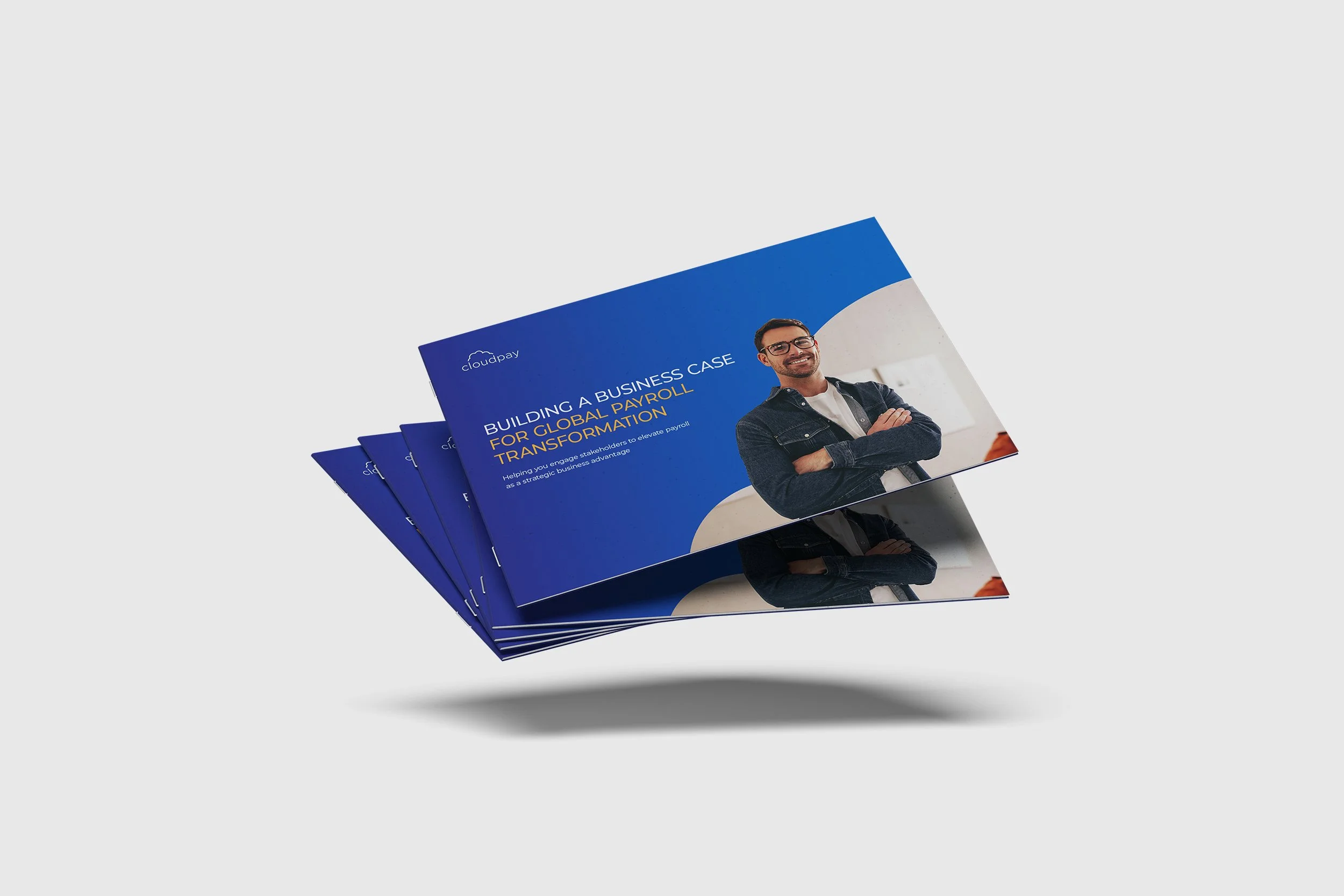 Brochure titled 'Building a Business Case for Global Payroll Transformation' with a smiling man wearing glasses and a denim shirt on the cover, placed on a white background.