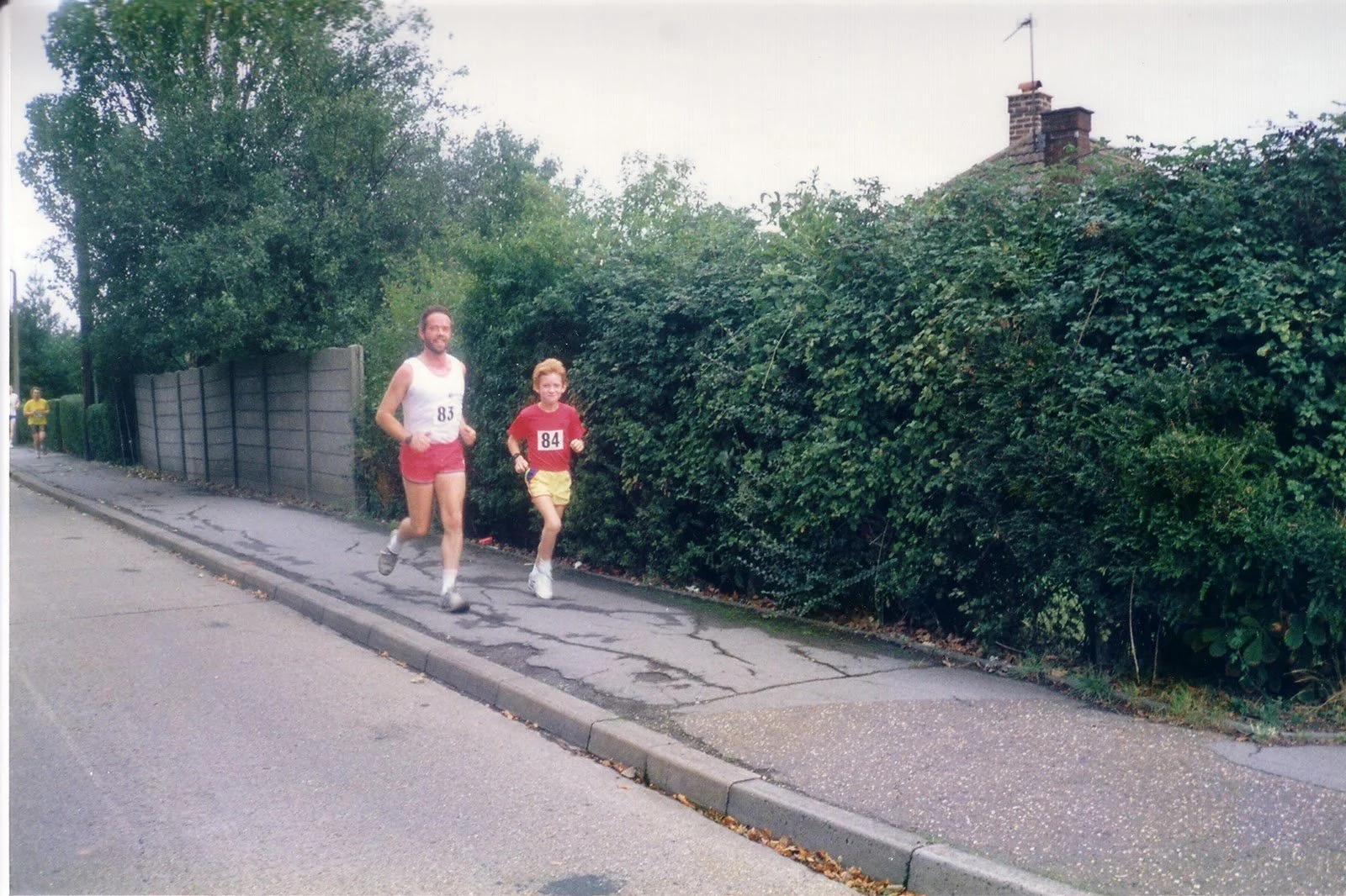 Young Tom Payn running in Tiptree with his dad