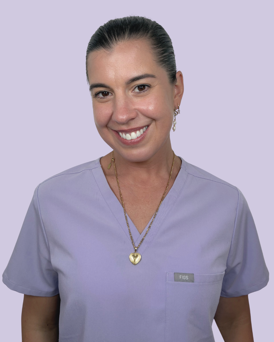 bella smiling behind lavender wall