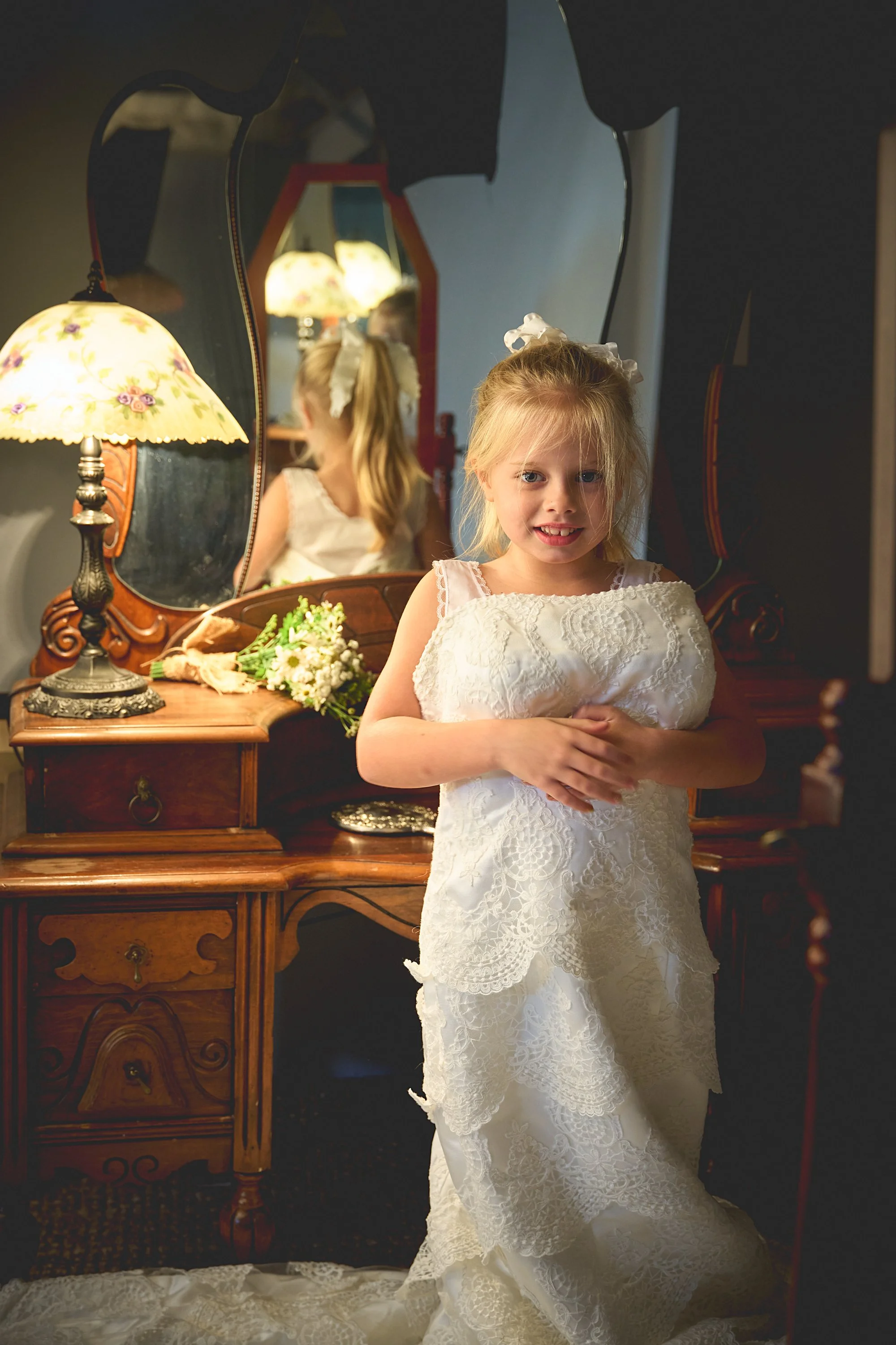 Sweet Family Moment: Young Daughter in Mommy’s Wedding Dress