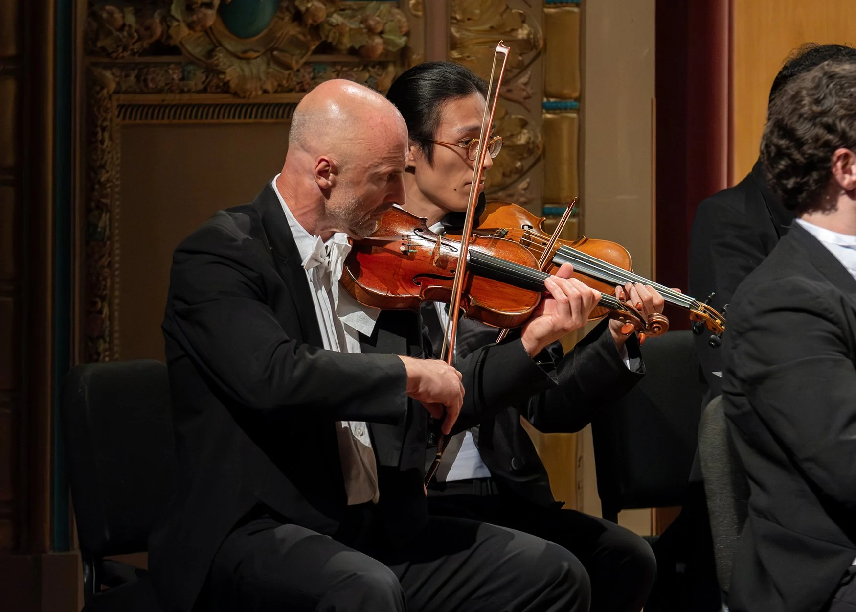 lpo_violins_playing_at_orpheum_theater_gk_photography_new_orleans.jpg