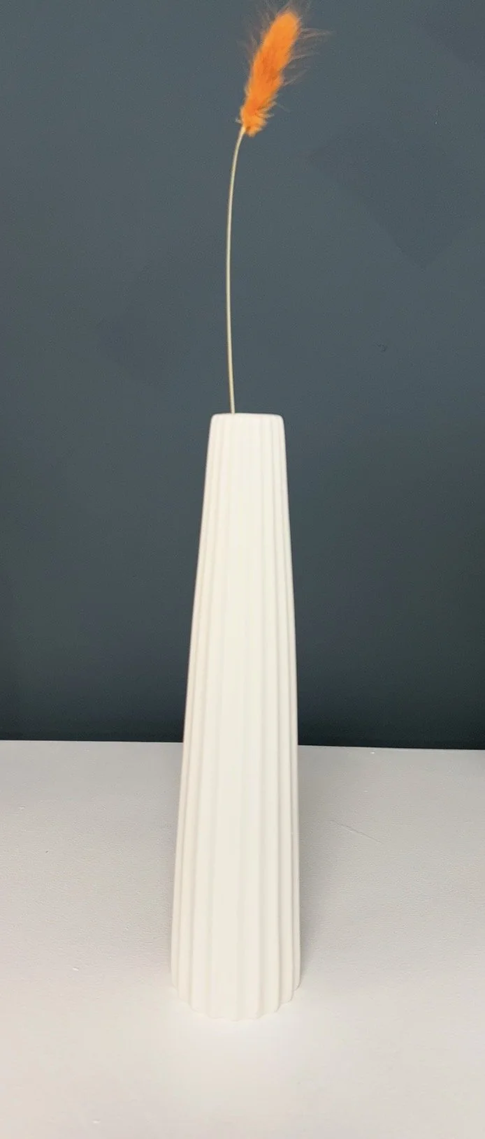 white slim ceramic ribbed vase