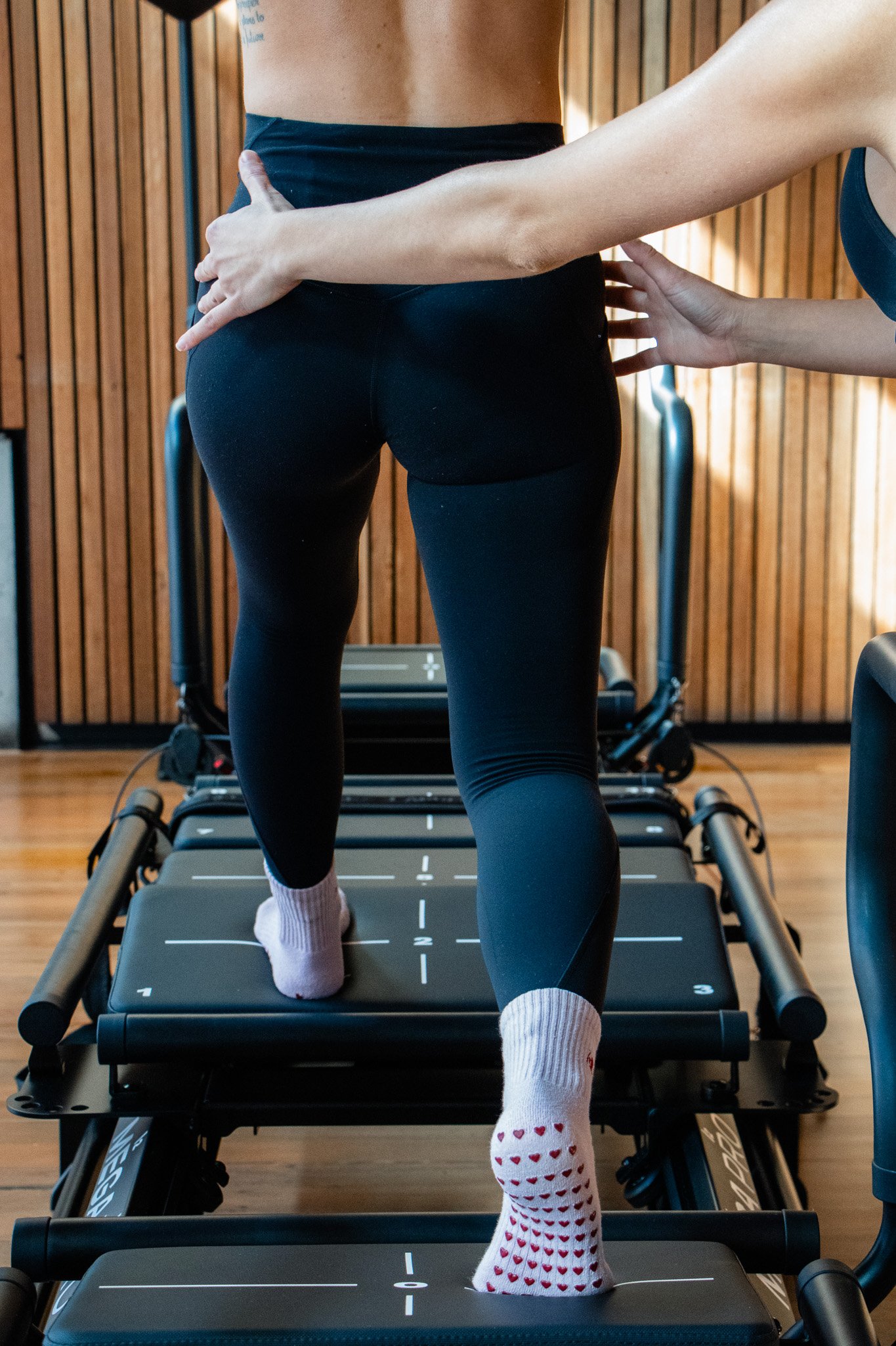 hands on adjustment in private pilates lagree class in brisbane - tactile cueing for better results.