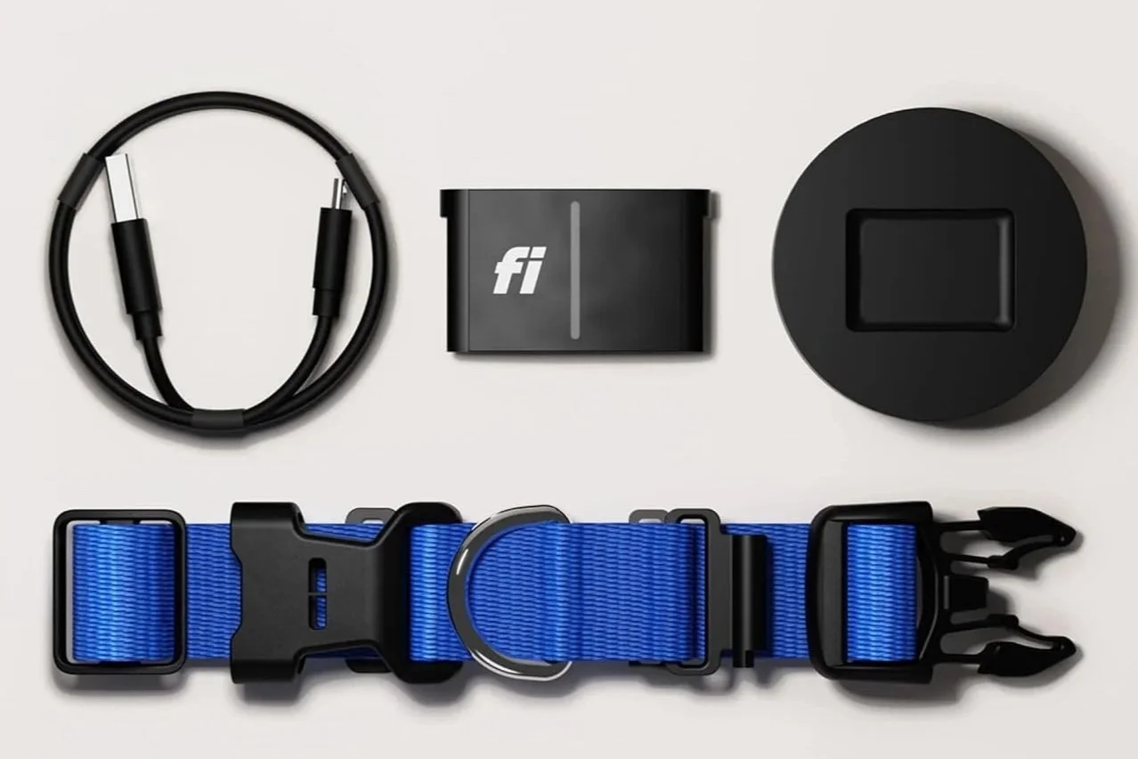 Fi Smart Collar Series 3 kit including blue dog collar, GPS tracker module, charging base, and USB-C cable laid out on a white background.