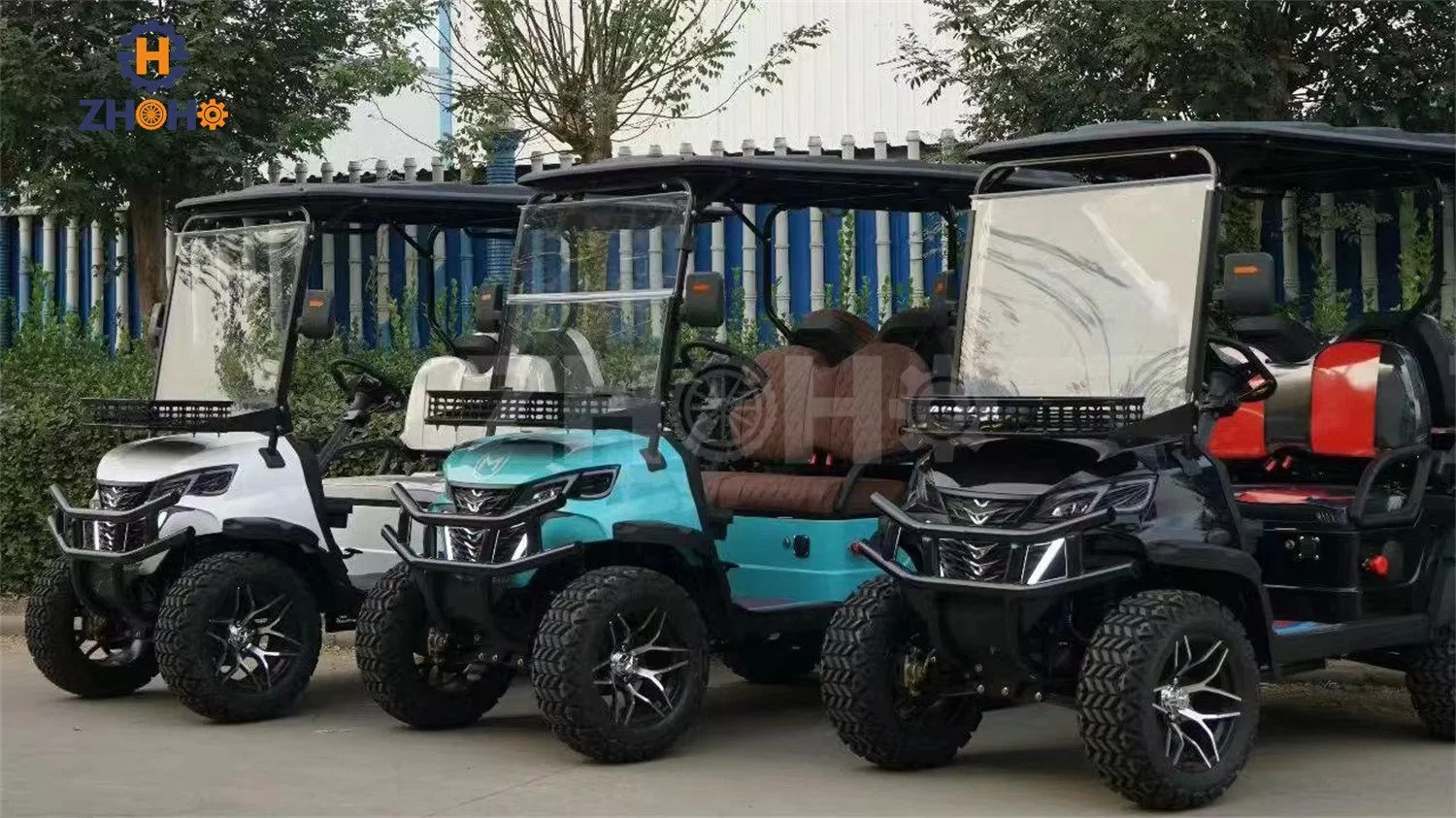 three of black red white golf carts