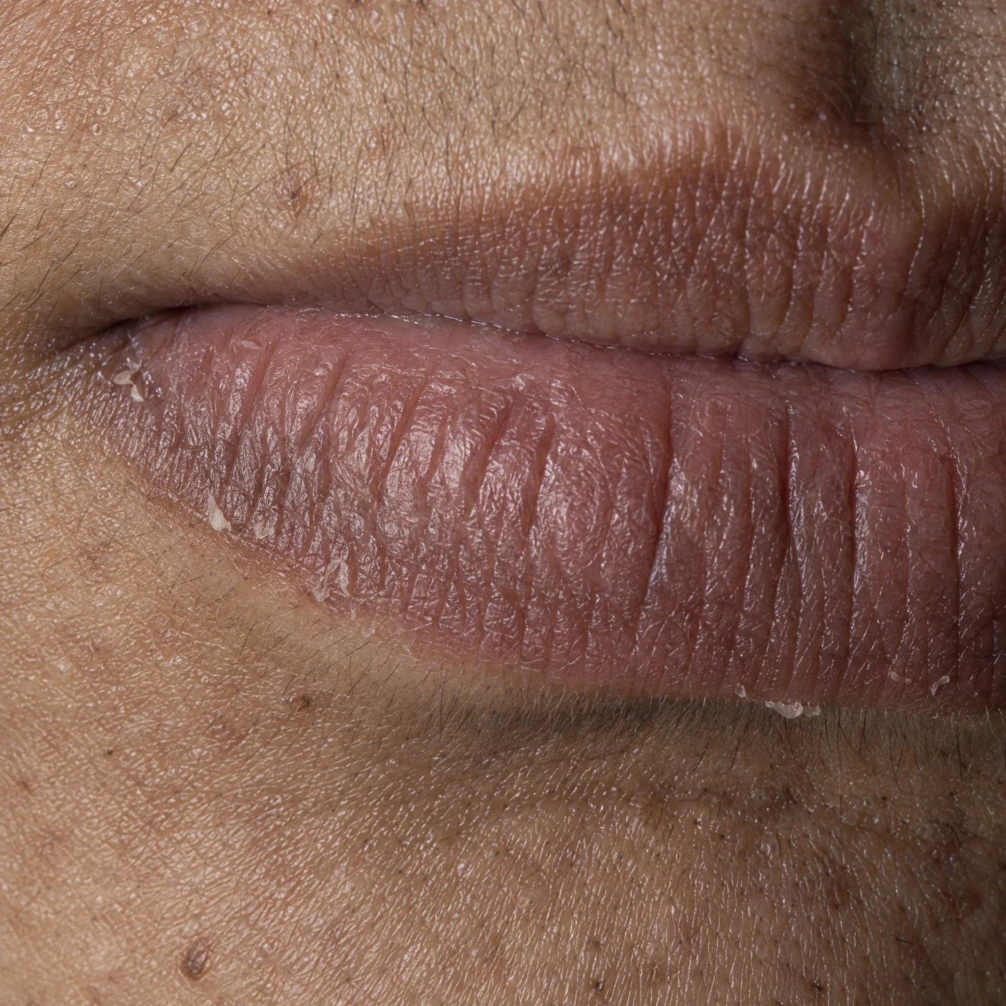 Extreme macro of natural, unretouched lips.