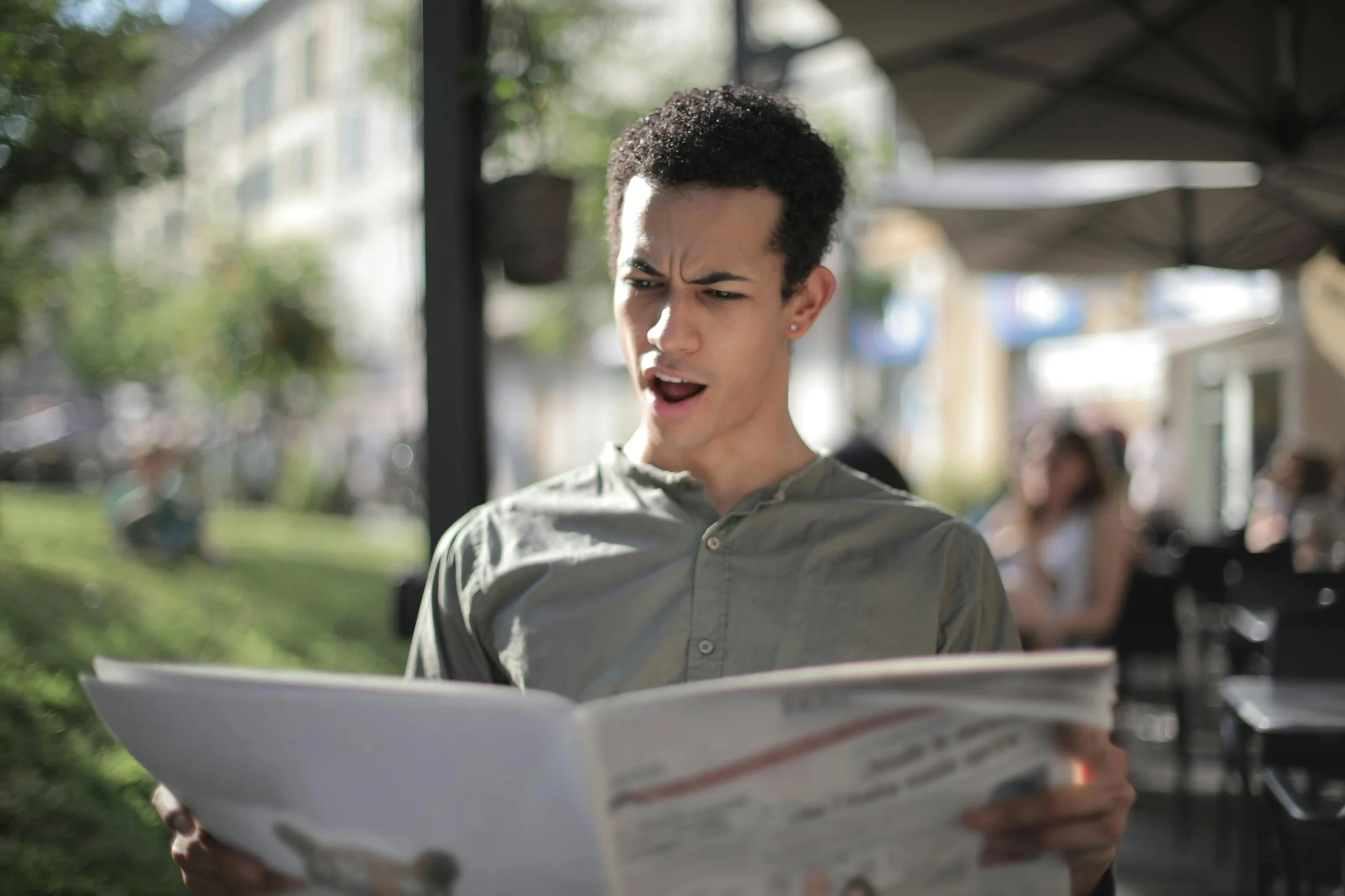 Man upset from news read in paper
