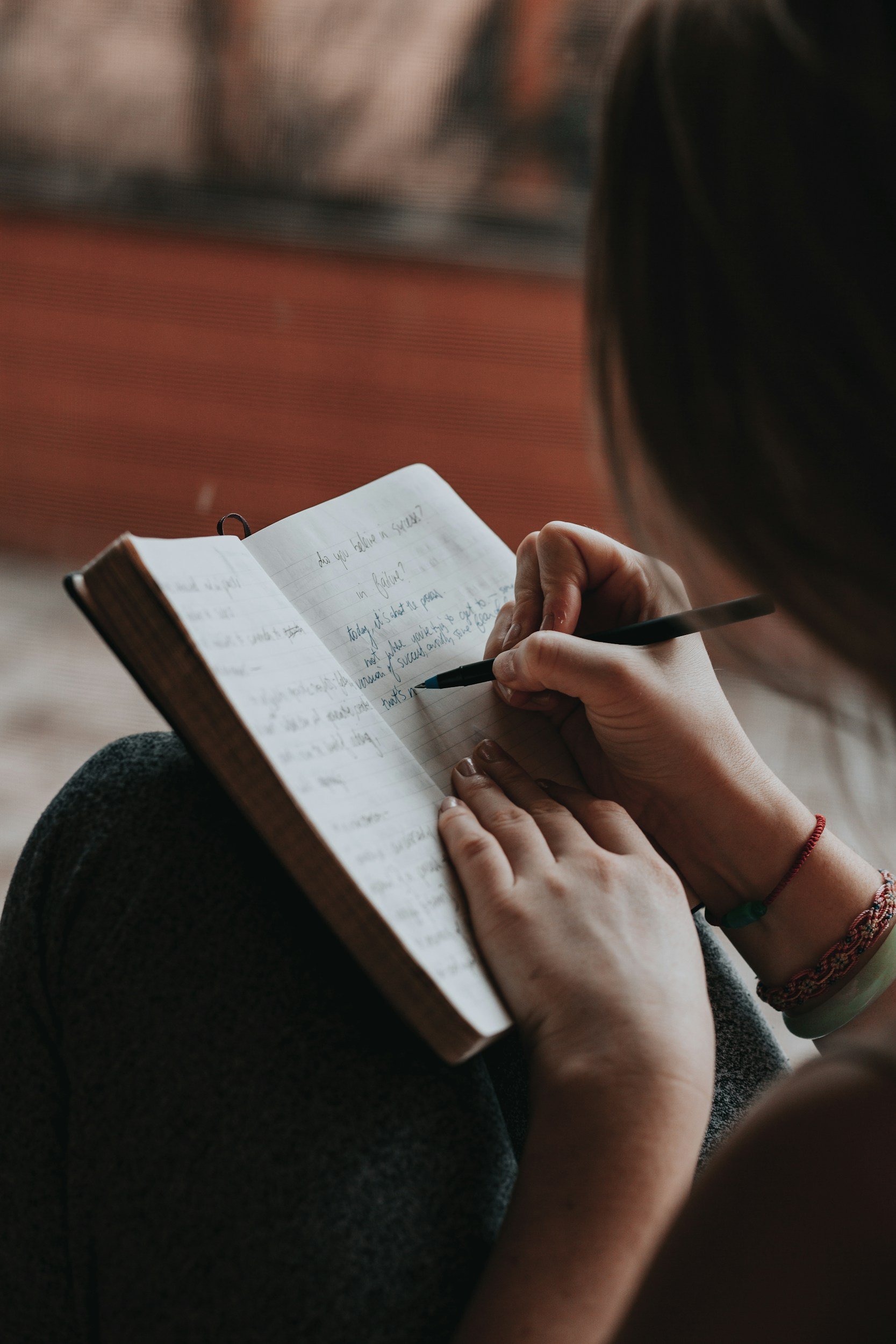 A woman journalling in a notebook