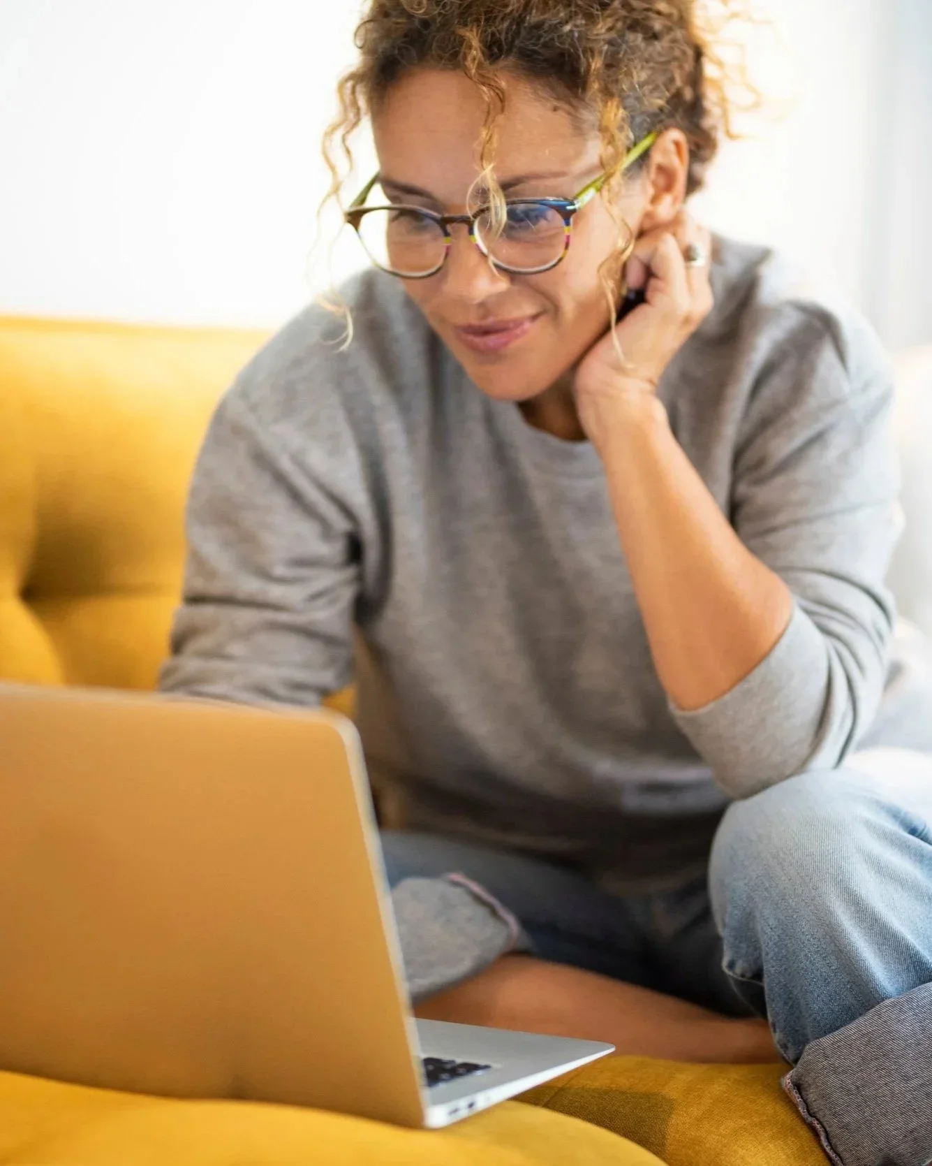 Secondary English teacher reviewing online reading instruction training on a laptop
