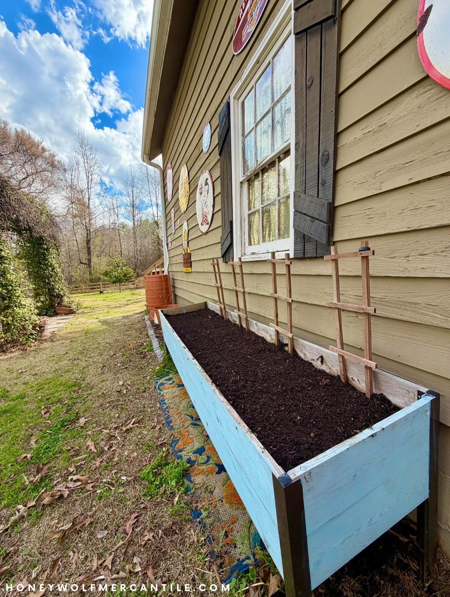 Some ppl might look at this photo and see an uninspiring box of dirt. Others may look at it and see possibilities. 

Honeywolf Mercantile is part of the latter club. What does this have to do with candles, you may ask? 

We understand that we have to