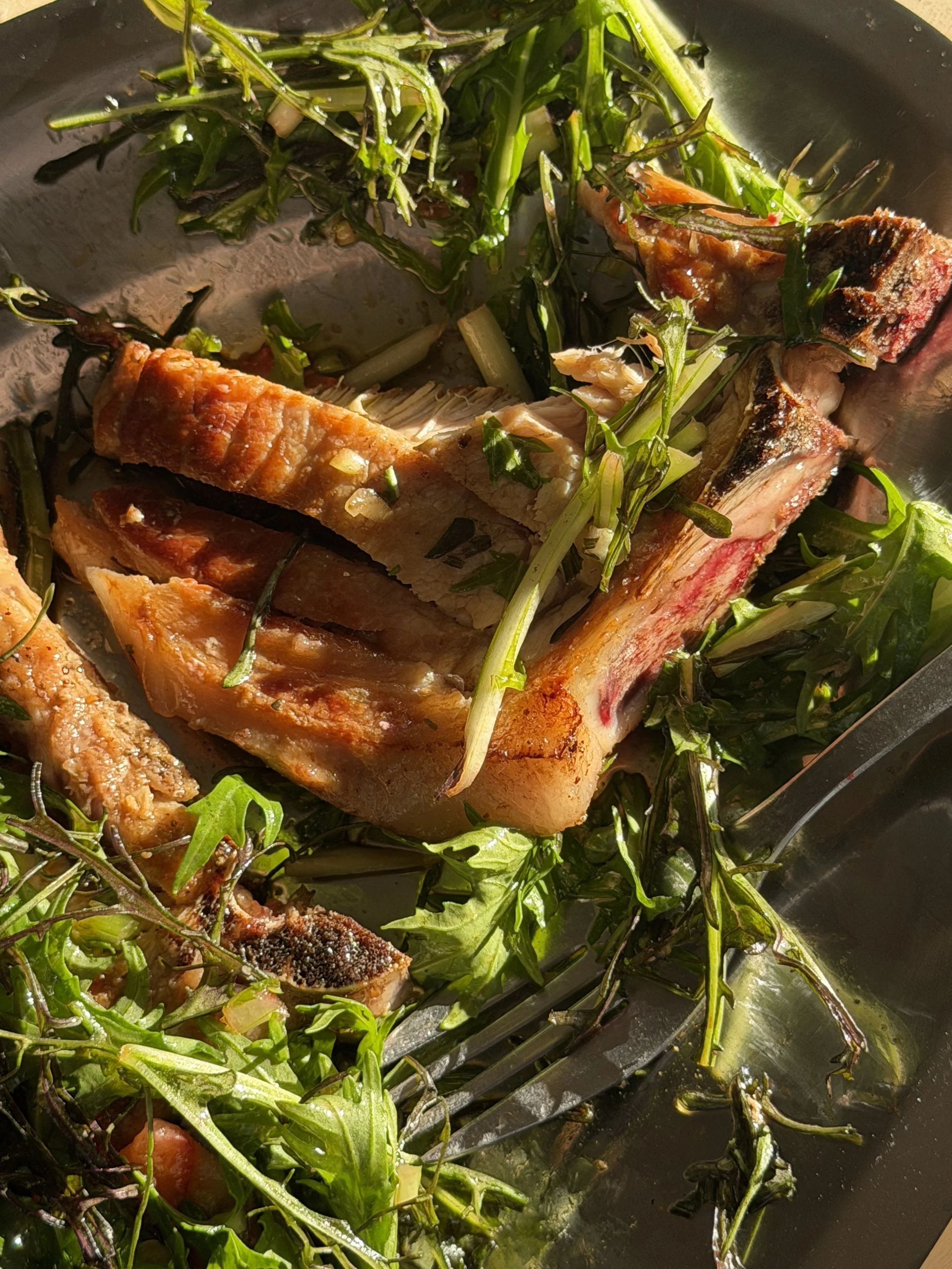 Pork chop, strawberry, and summer greens.