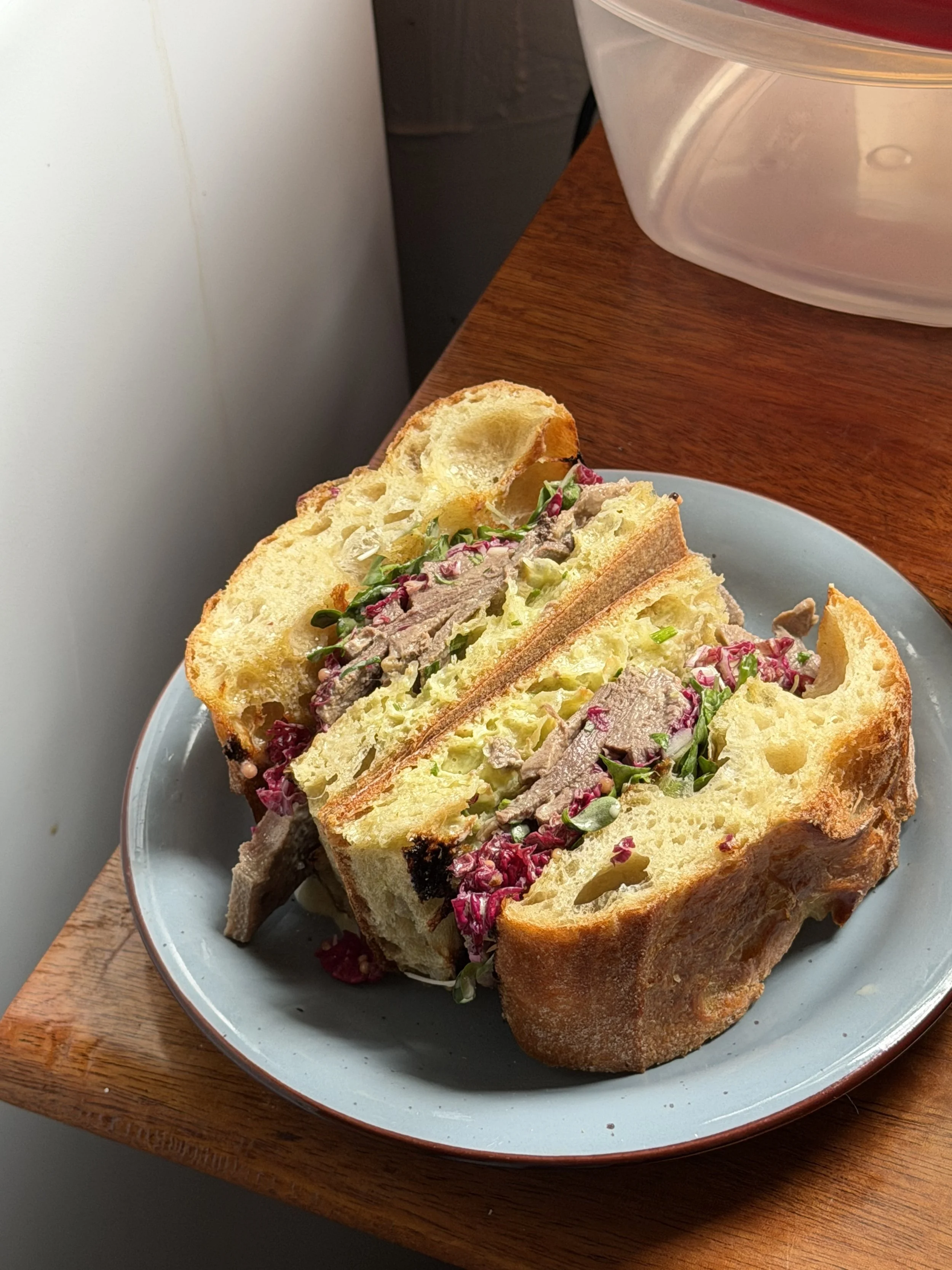 Beefy, pickly, herby aioli follicular sandwich.