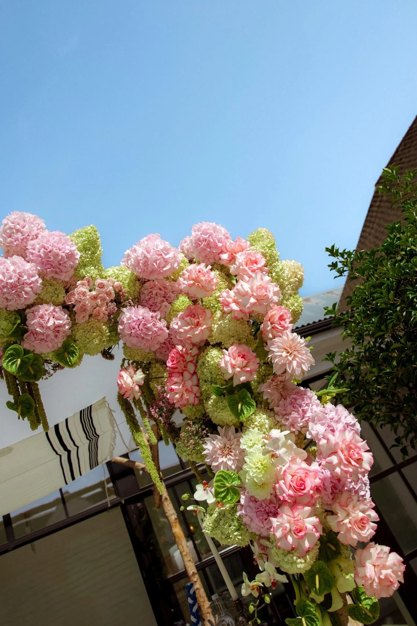 Modern pink & green wedding ceremony flowers