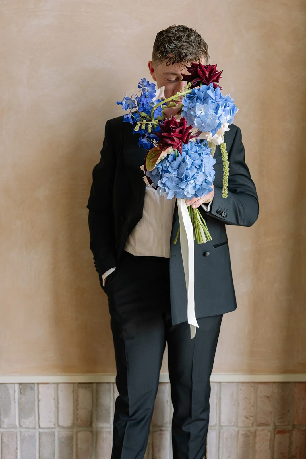 Modern cascading bridal bouquet at LIMEKILN Sussex
