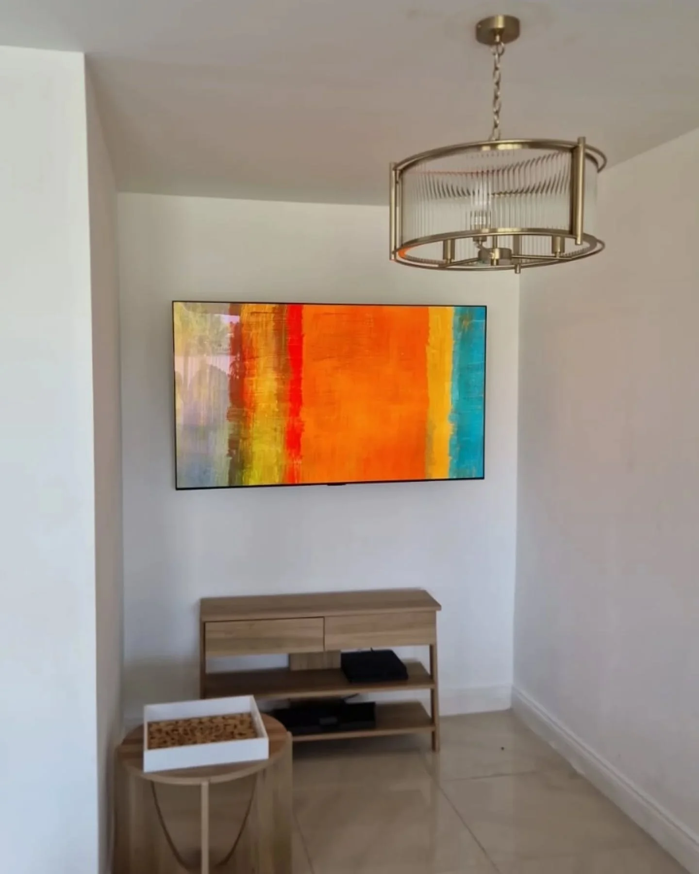 TV installed on wall, power and cable management installed behind cabinet and tv for a clean flush look.

New light fitting installed to compliment area.