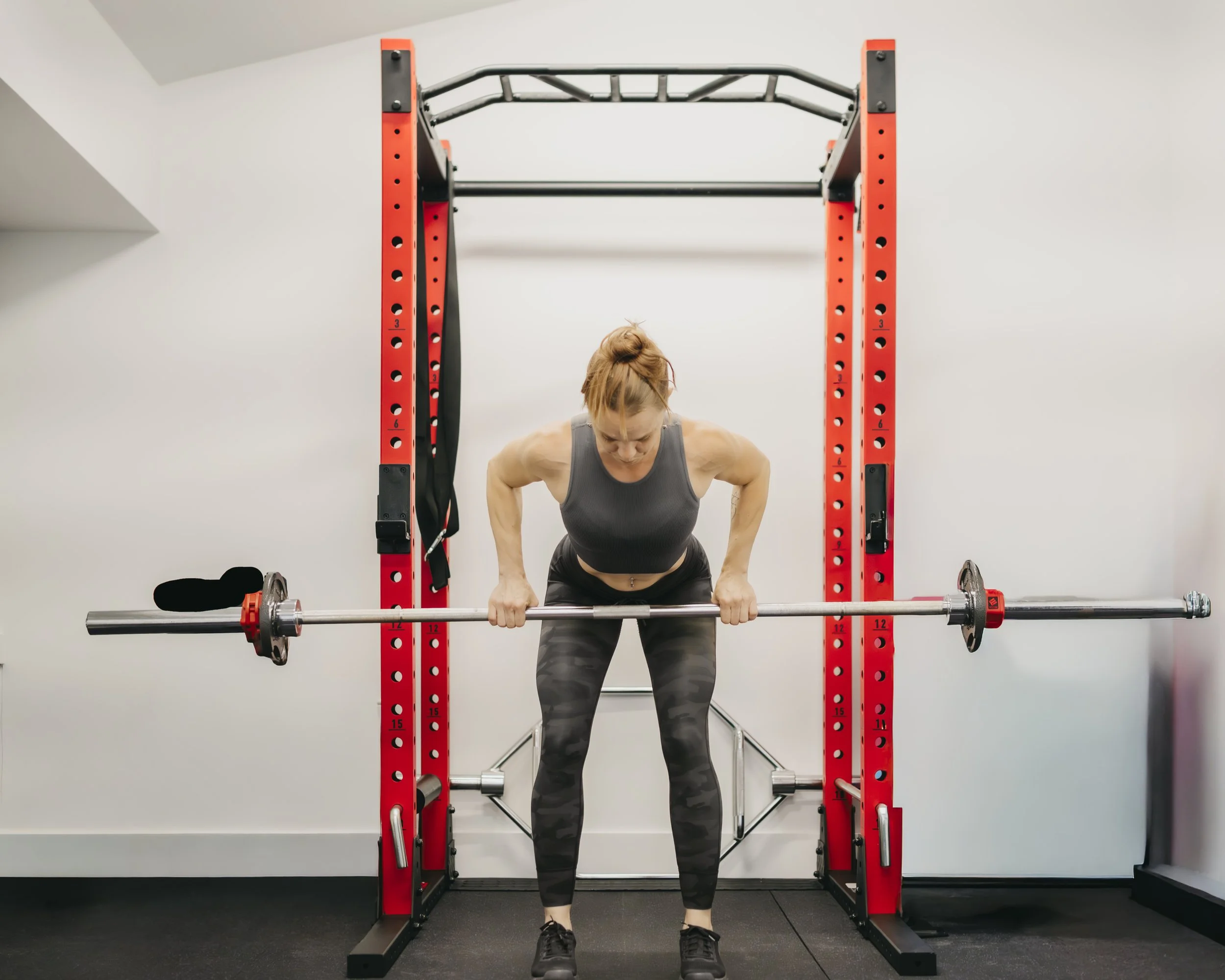 Personal Trainer Performing Bent Over Row