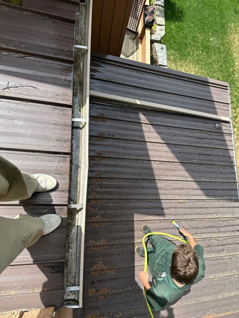 valley shiners clearing a gutter on a home in Invermere, British Columbia